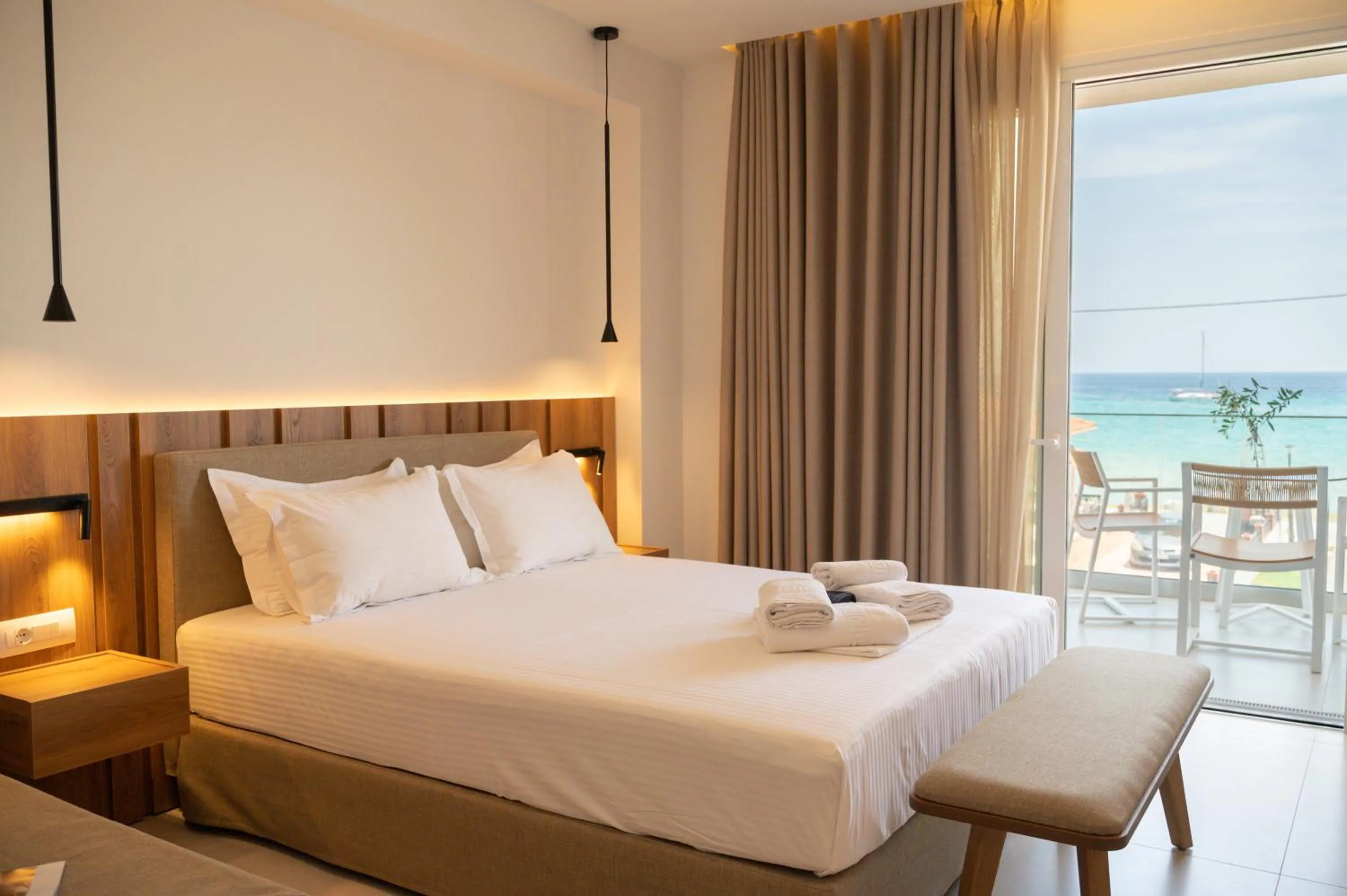 Bed in Sunrise SeaSide Suites