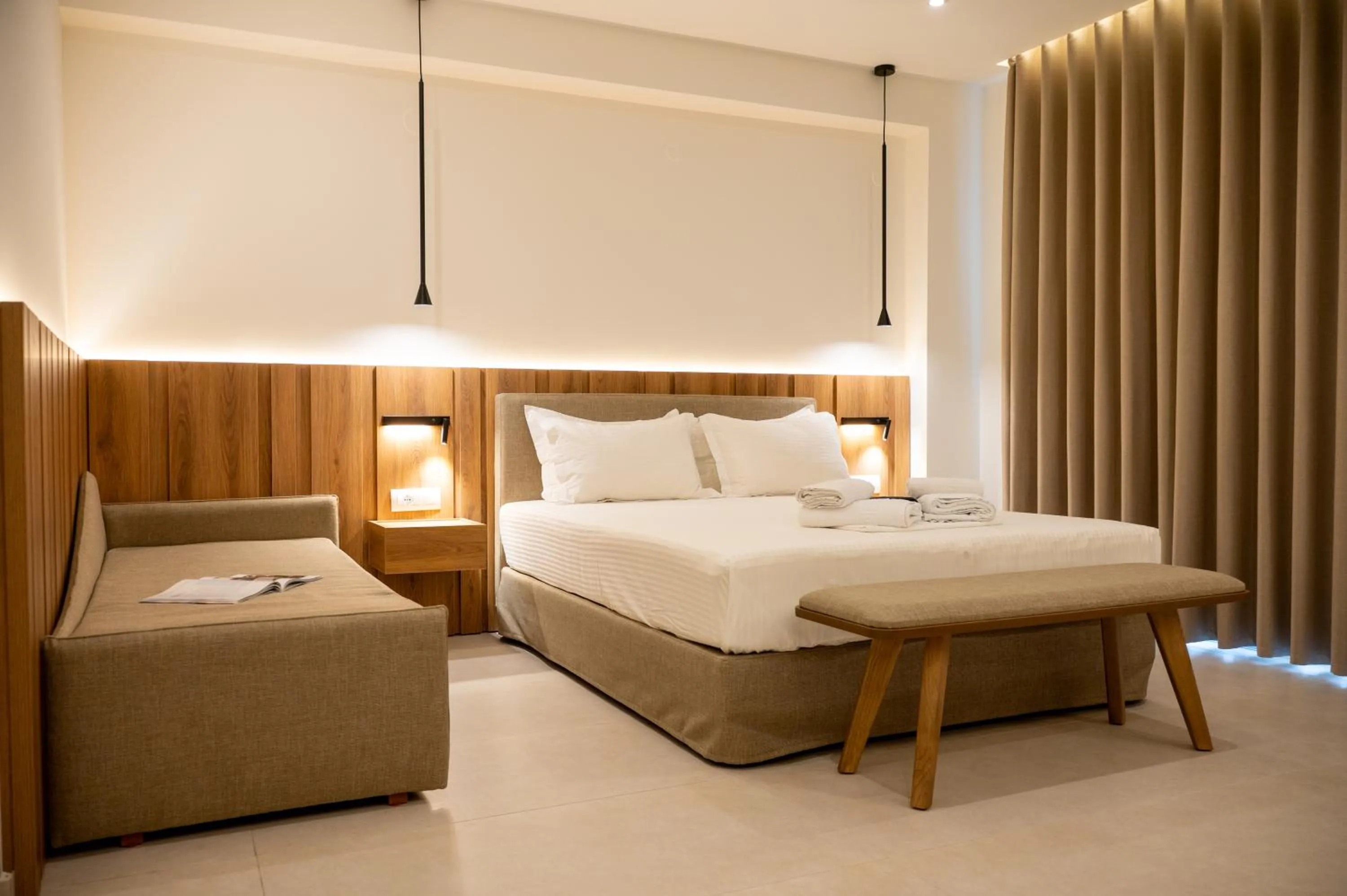 Bed in Sunrise SeaSide Suites