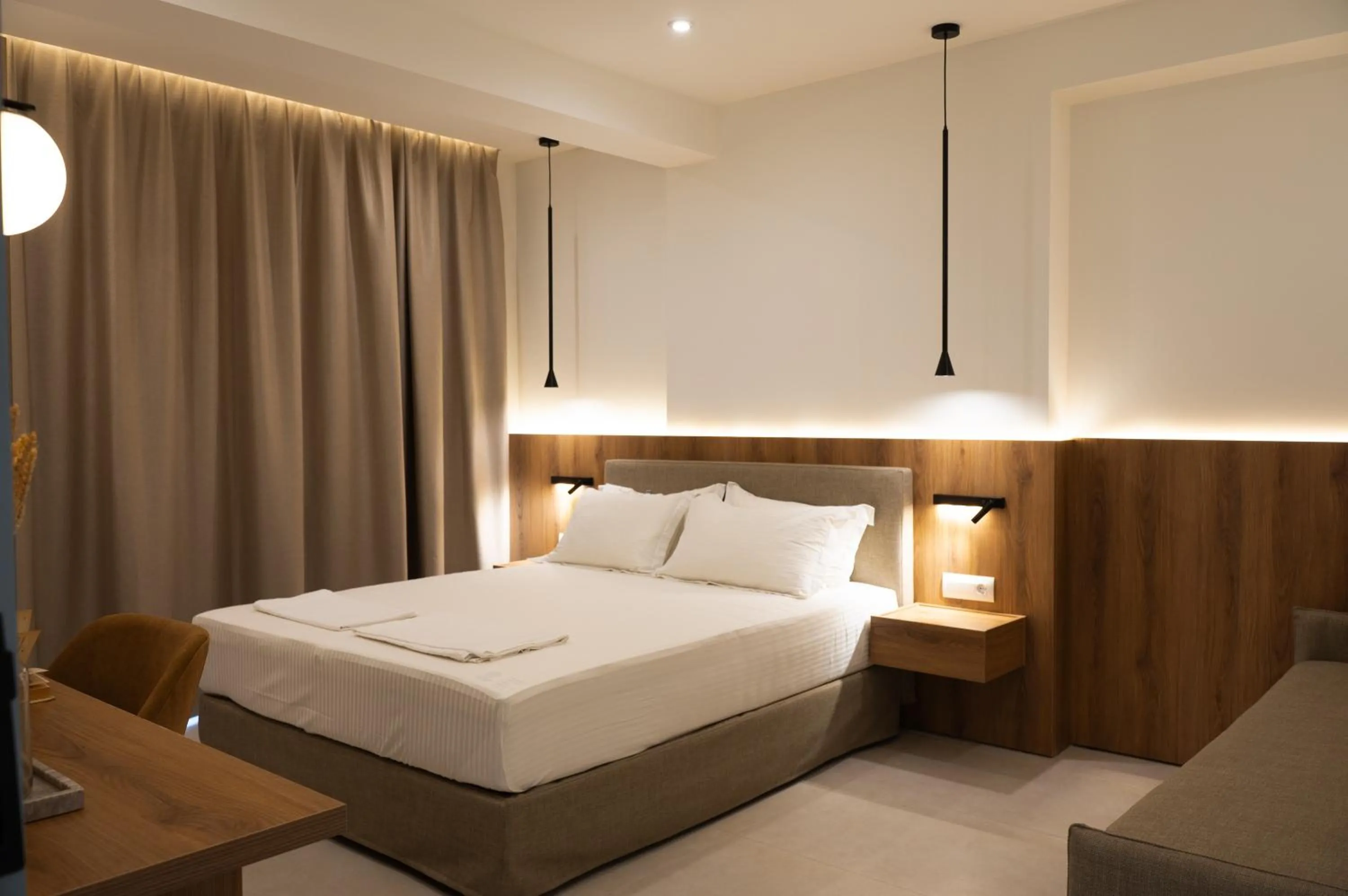 Bed in Sunrise SeaSide Suites