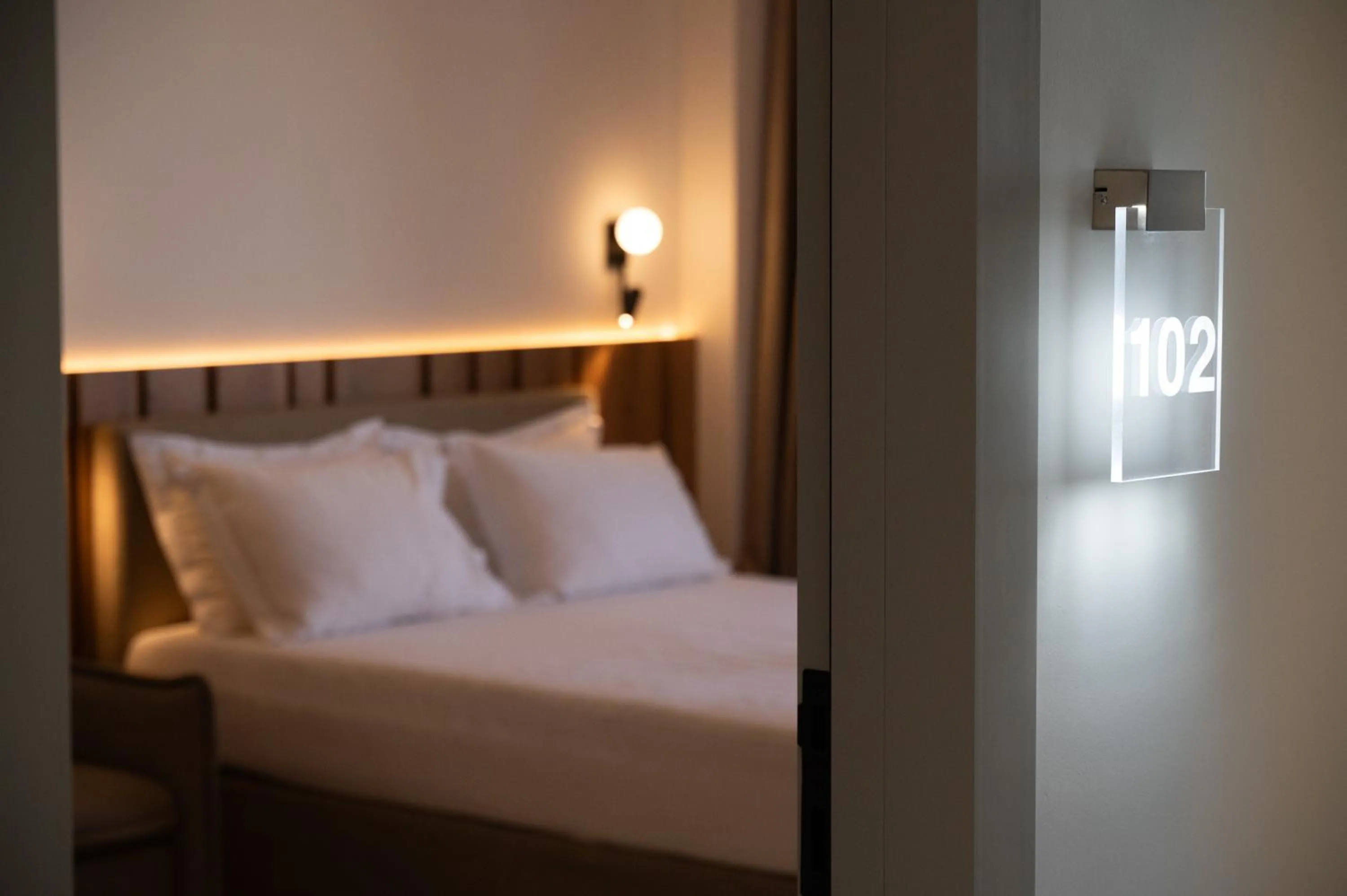 Bed in Sunrise SeaSide Suites
