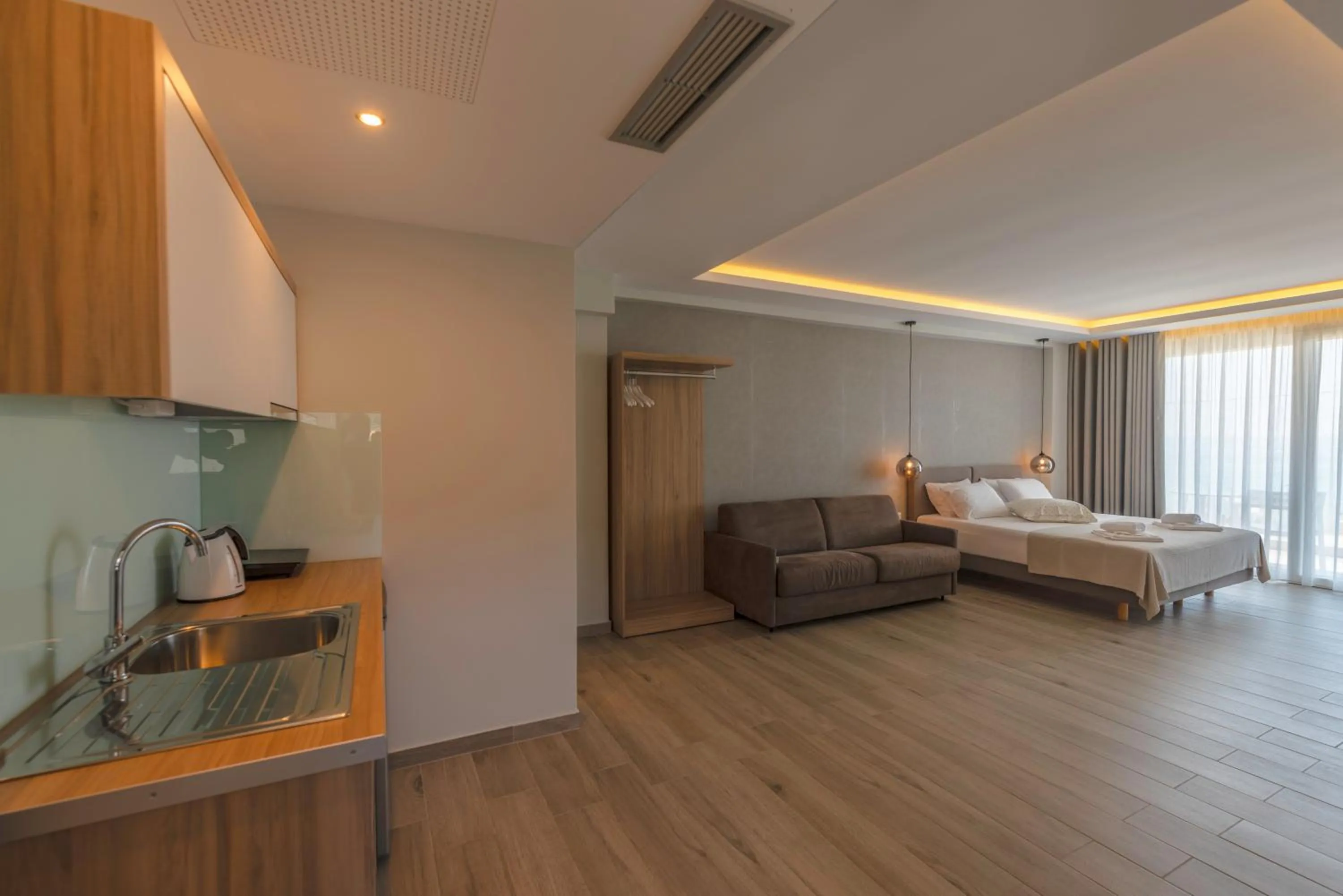Bed in Sunrise SeaSide Suites