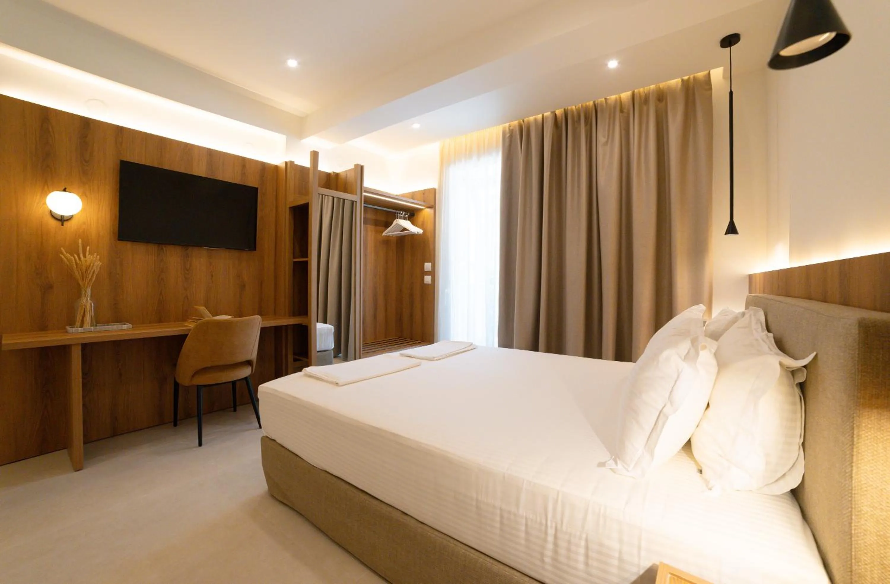 Bed in Sunrise SeaSide Suites