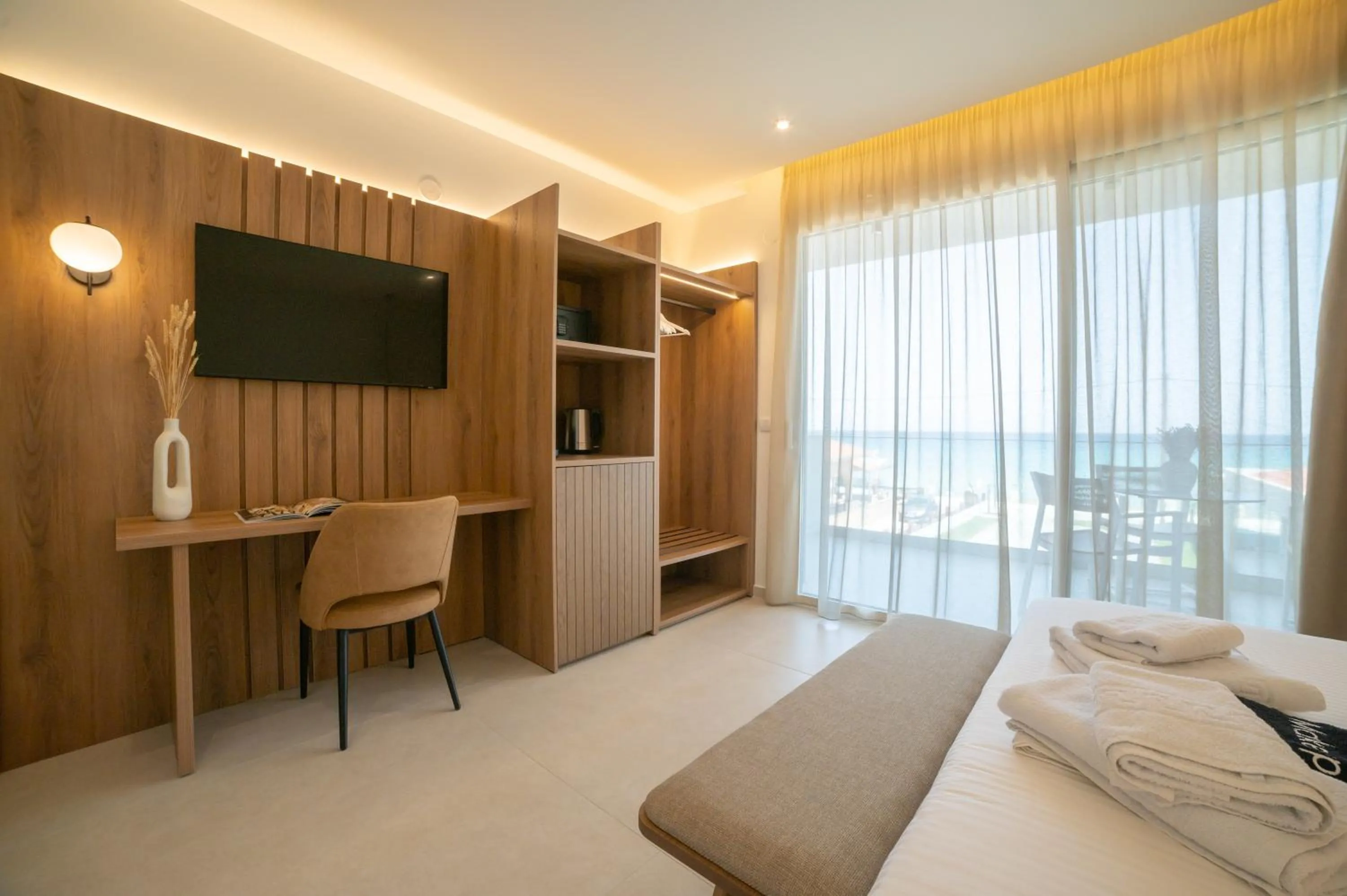 Bed in Sunrise SeaSide Suites