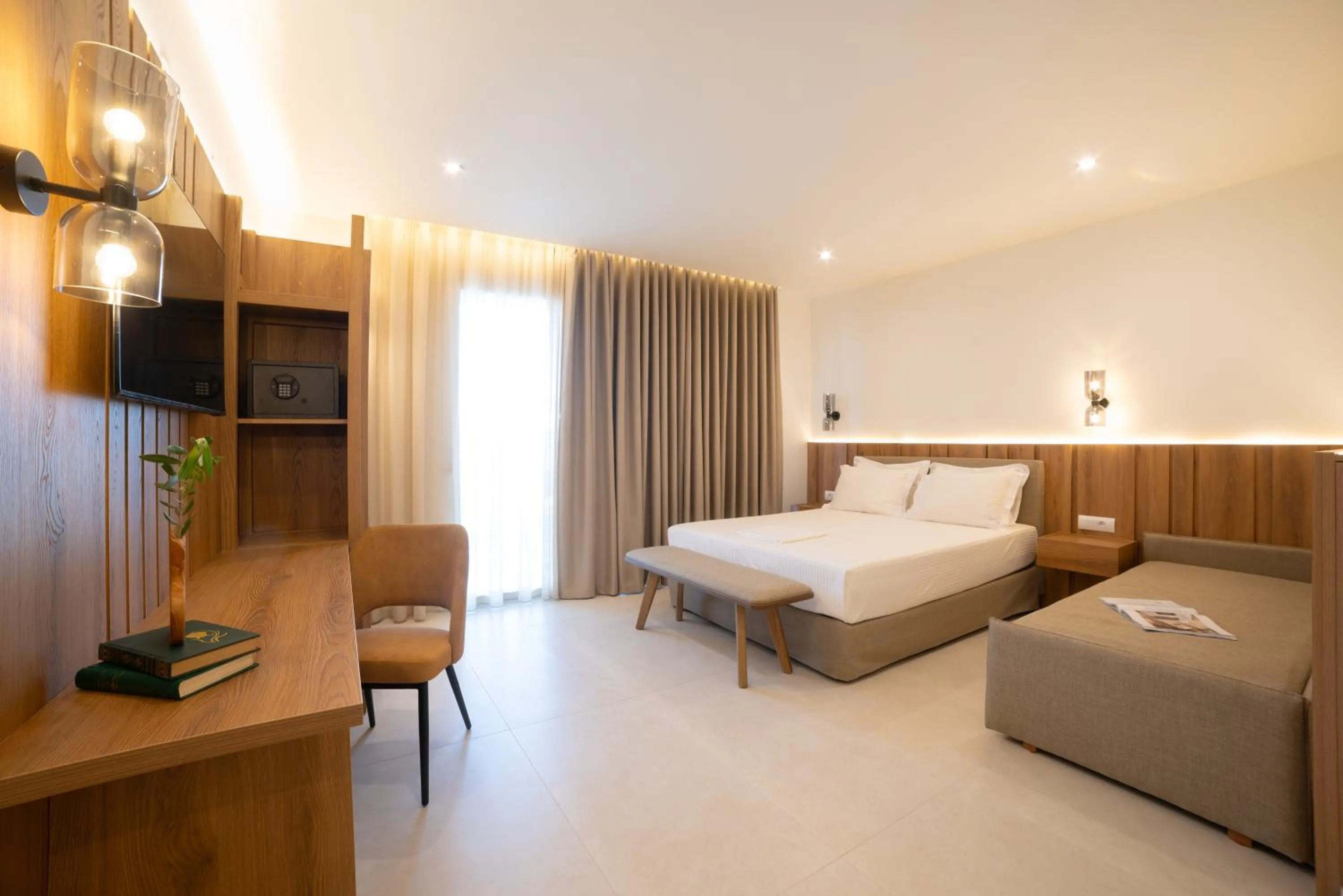 Bed in Sunrise SeaSide Suites