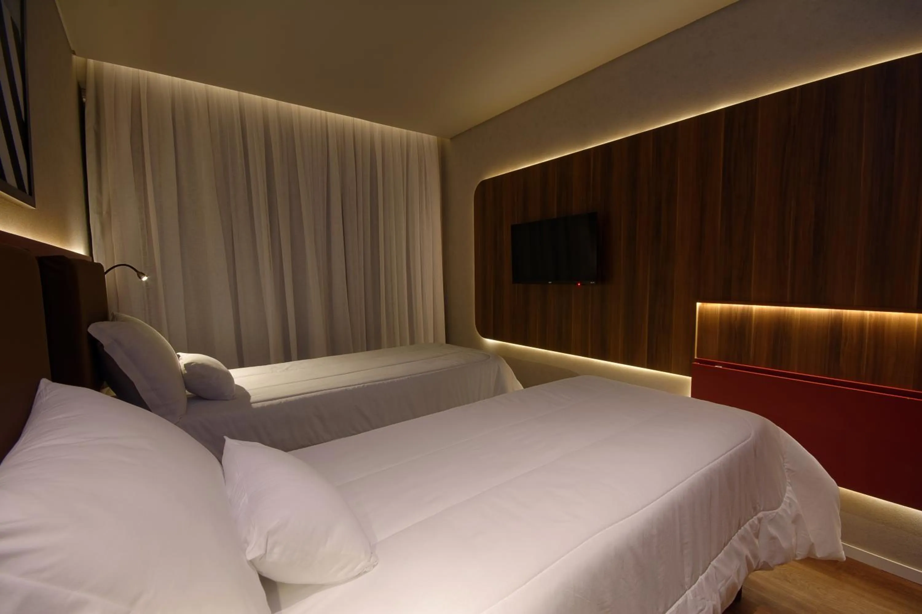 Bed in Golden Tower Express Nações Unidas by Fênix Hotéis