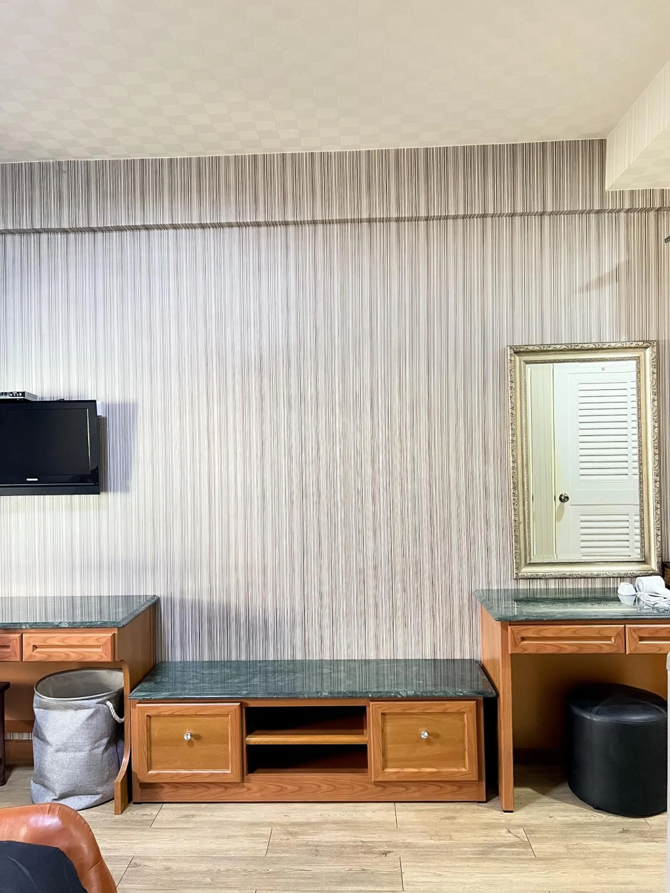 Communal lounge/ TV room in Silom Dynasty Hostel