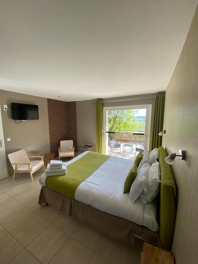 Bed in Hôtel Restaurant L'Art des Mets by Côté Jardin