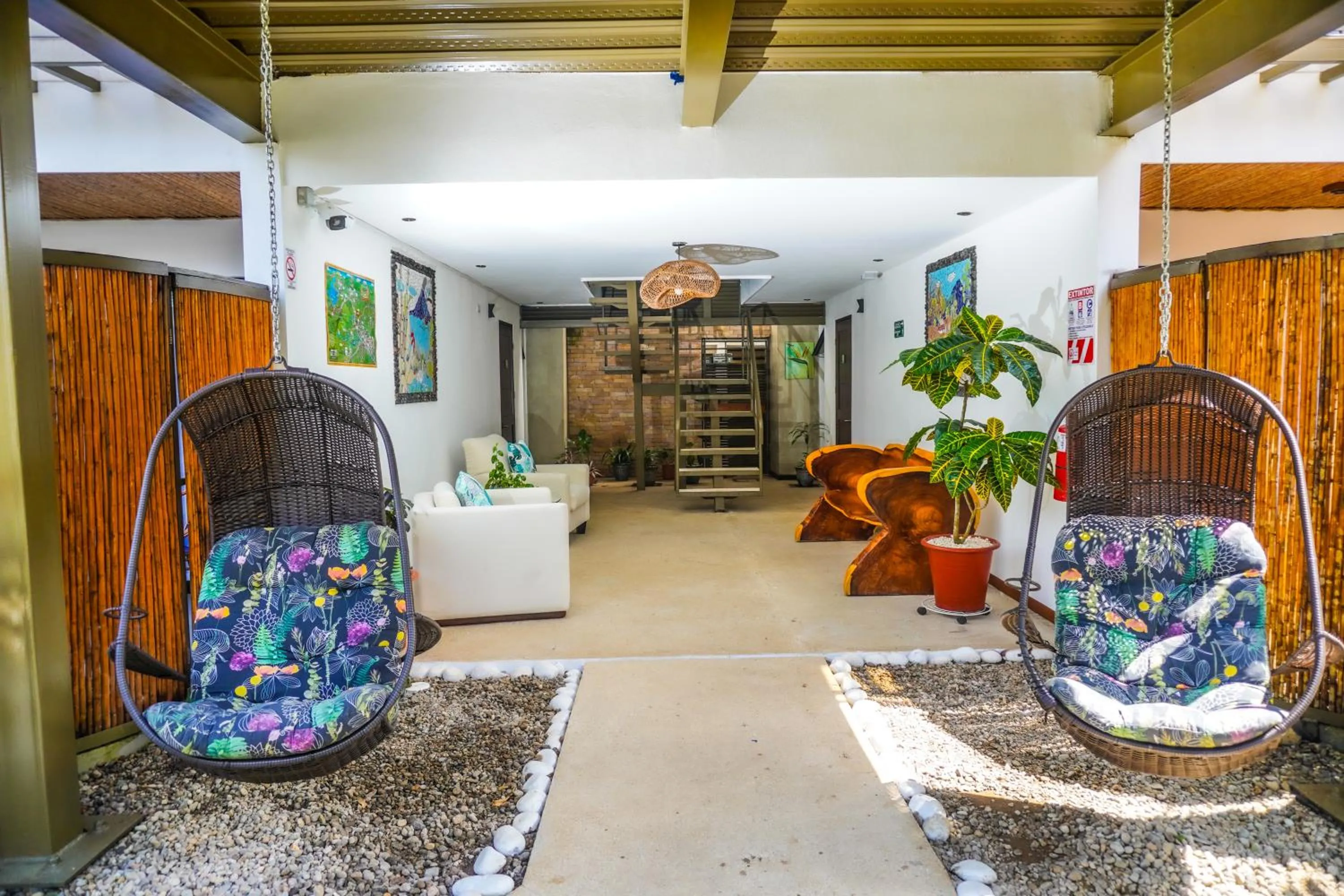 Seating area in La Fortuna Lodge by Treebu Hotels