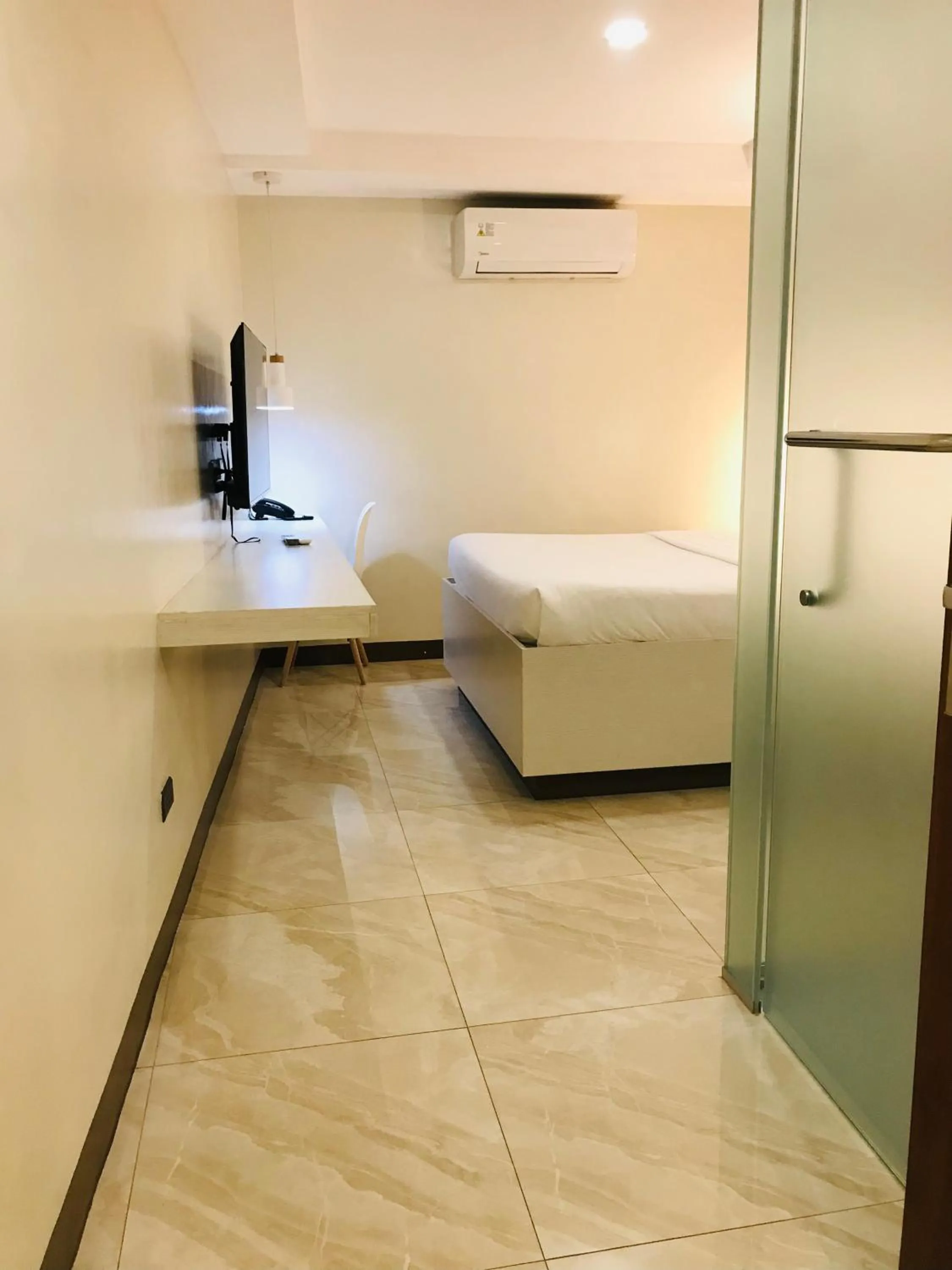 Bed in Oyster Plaza Hotel