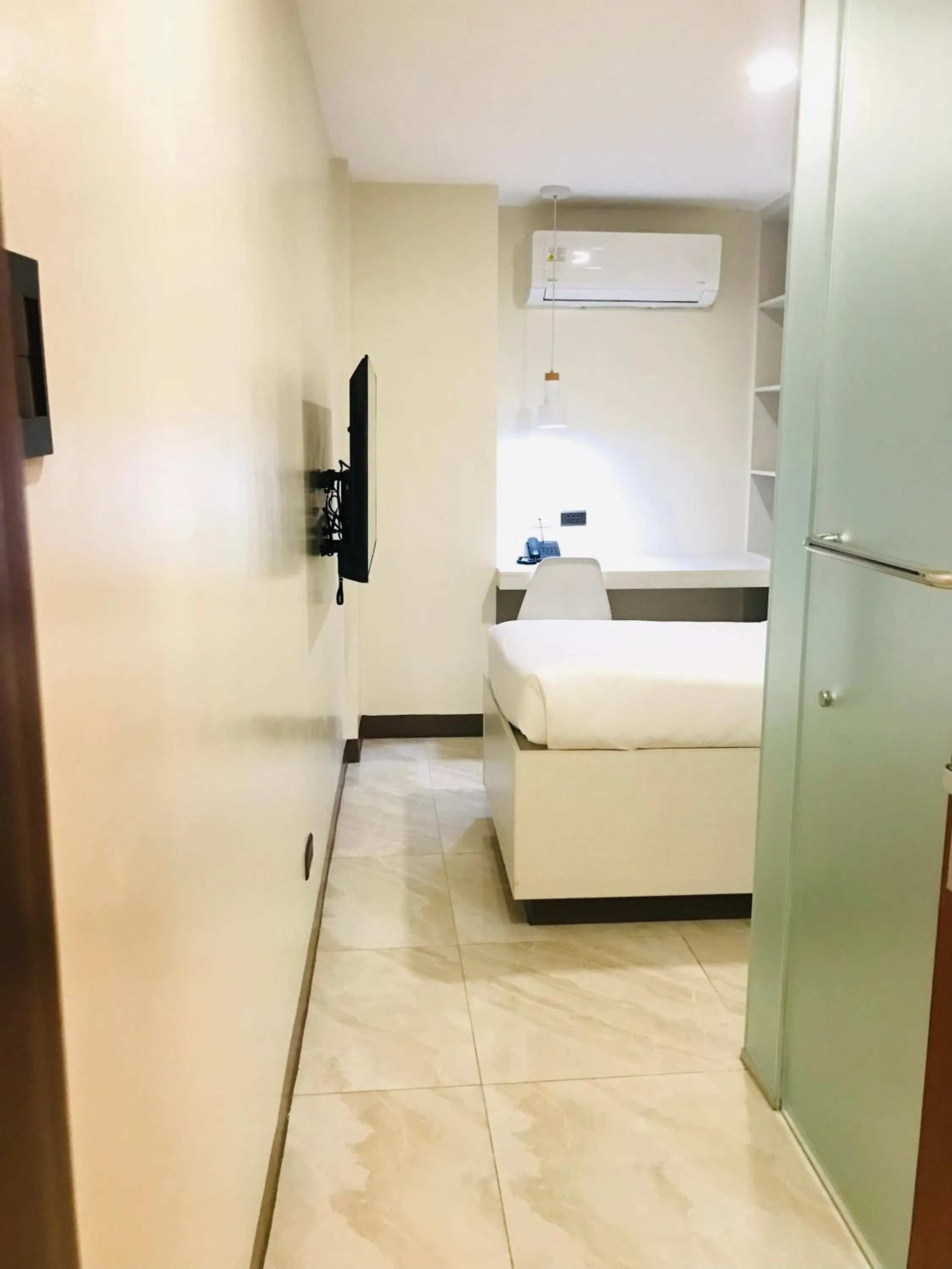 Bed in Oyster Plaza Hotel