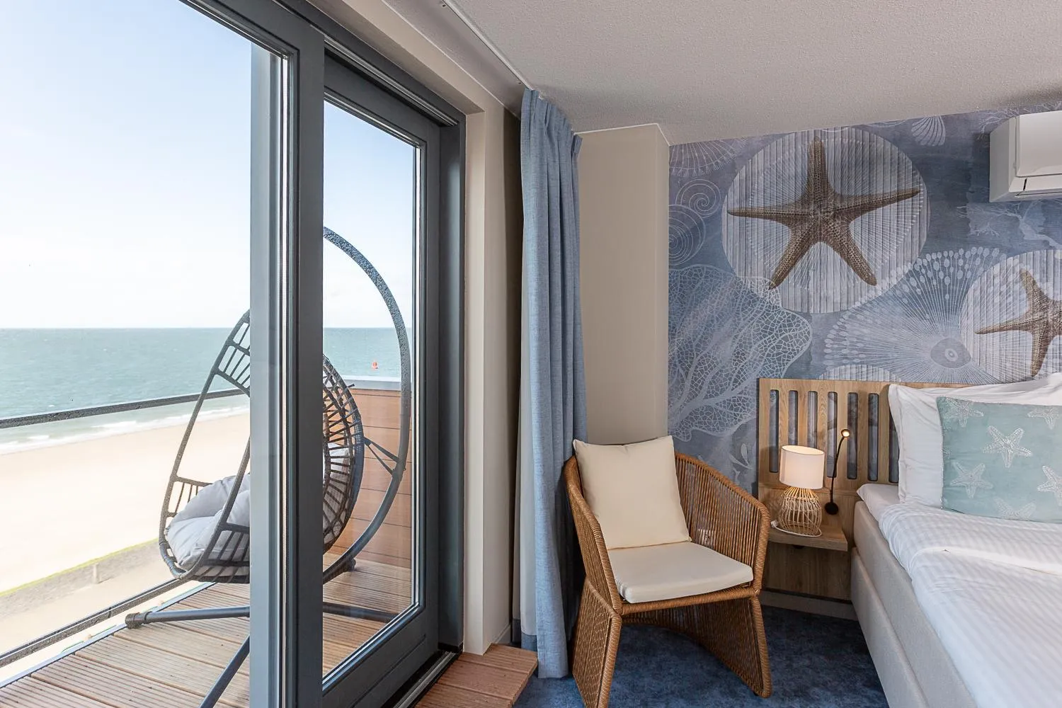 Seating area, Bed in Beachfront Boutiquehotel