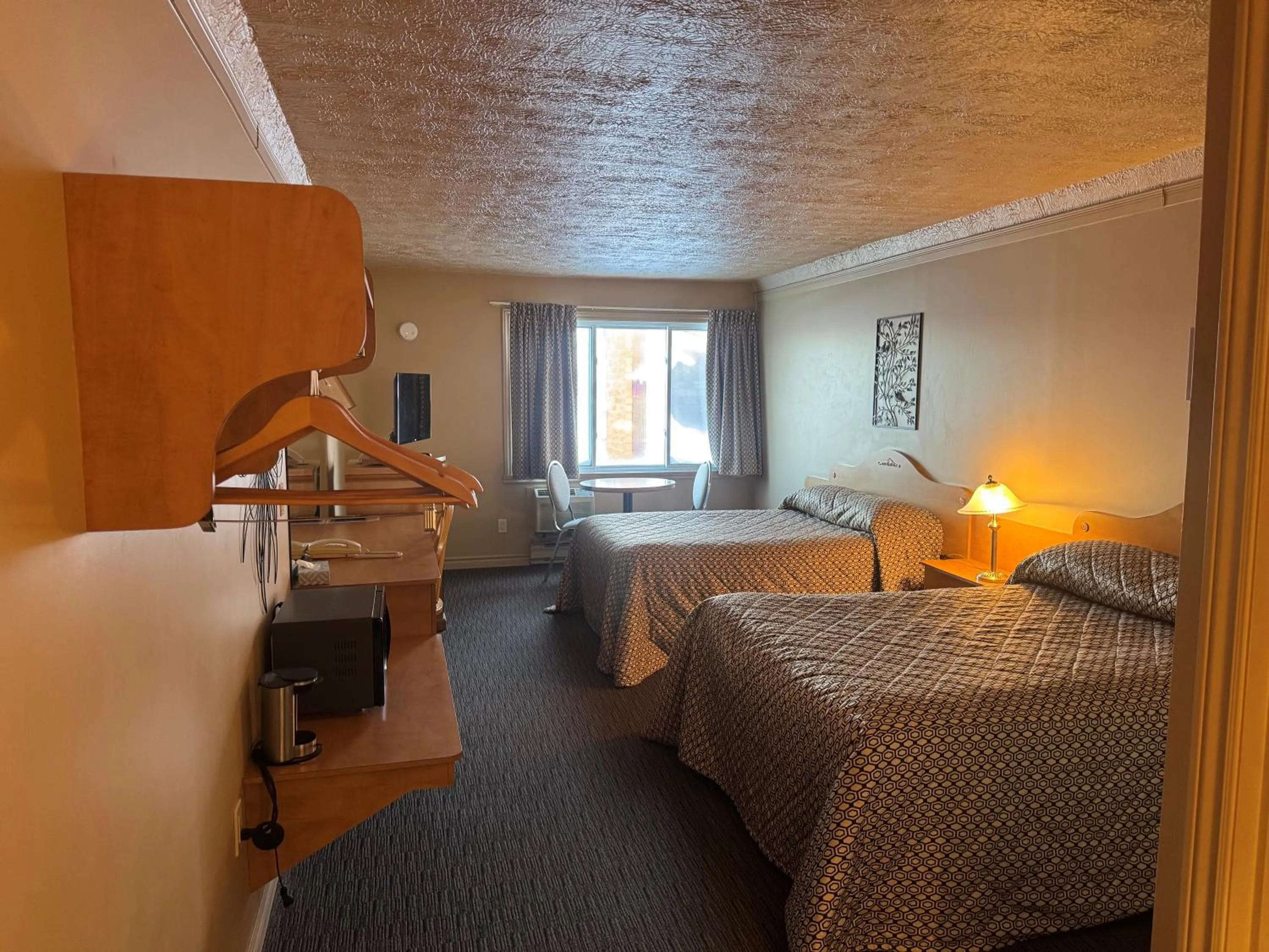 Bed in Travelodge by Wyndham Drummondville