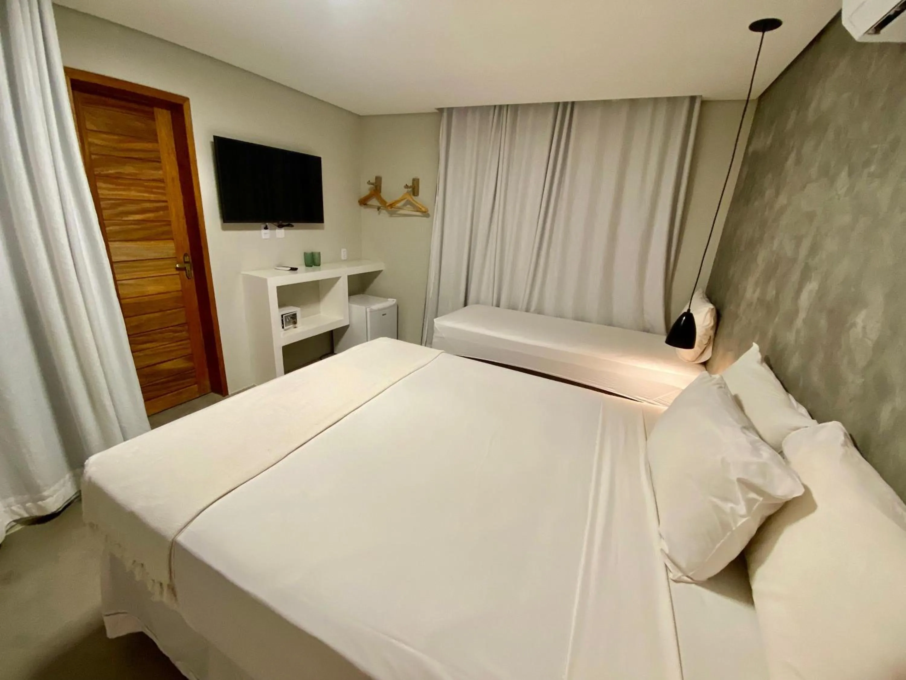 Bed in Pousada Baobá