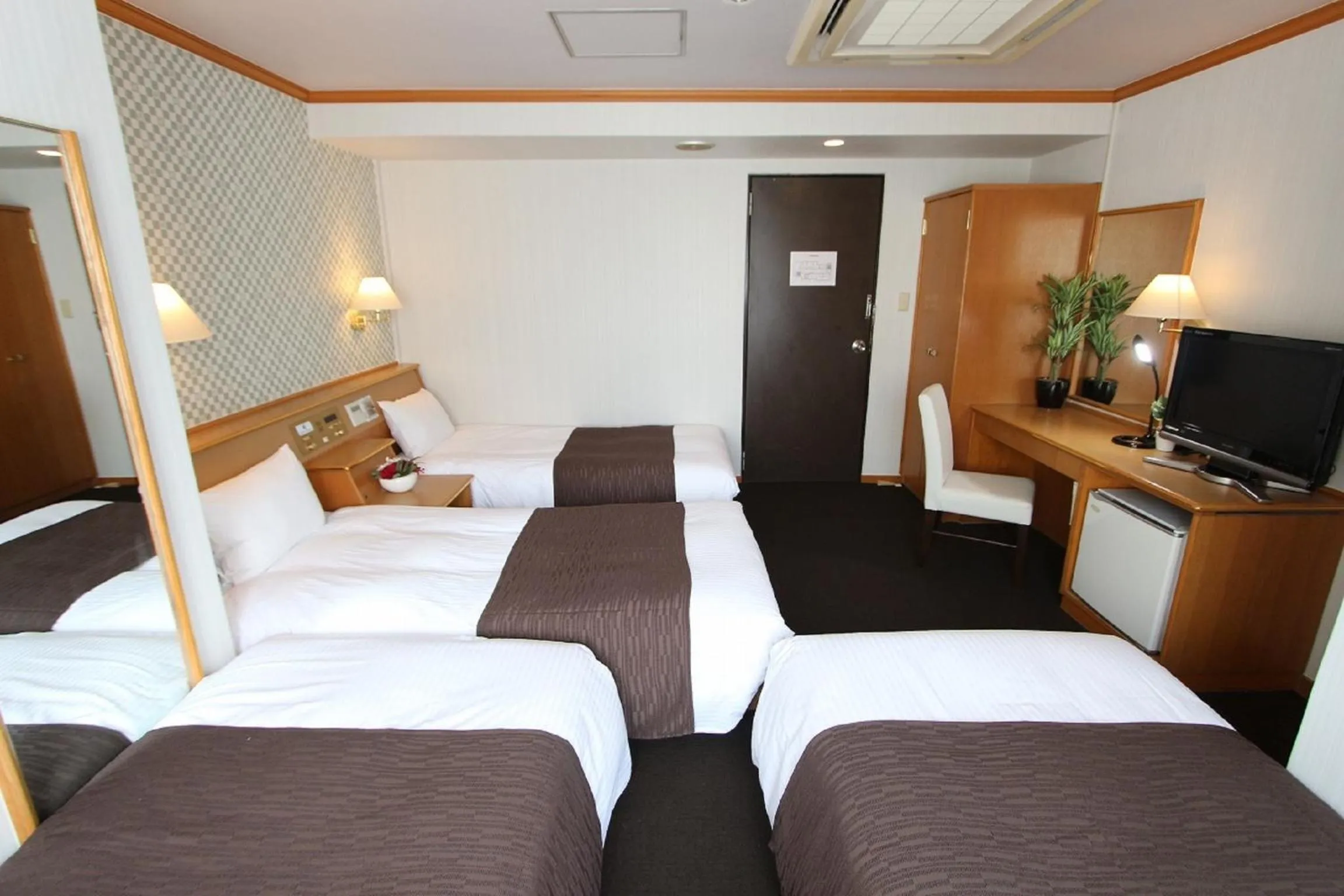 Bedroom in HOTEL LiVEMAX BUDGET Okinawa Tomariko