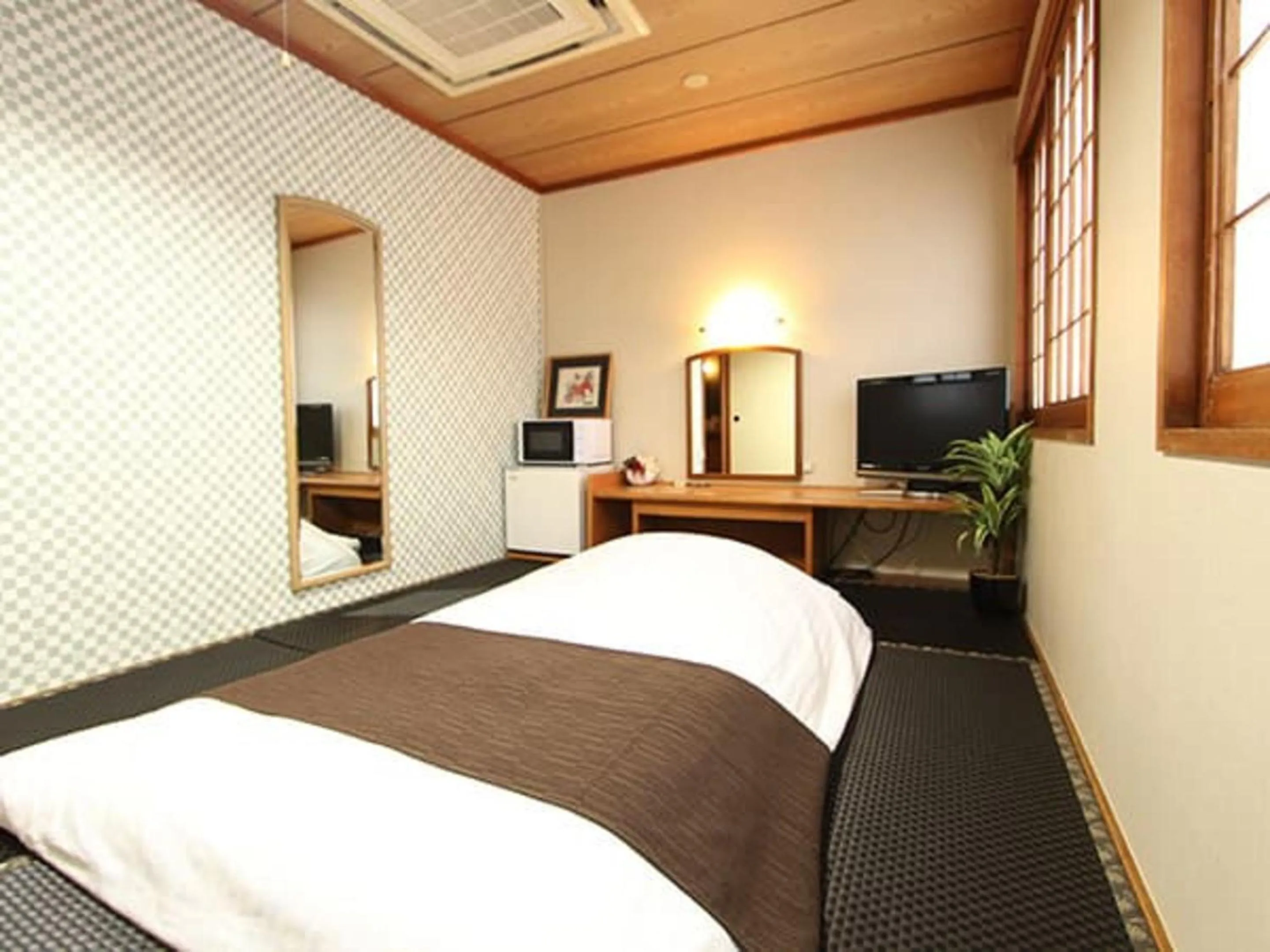 Bed in HOTEL LiVEMAX BUDGET Okinawa Tomariko