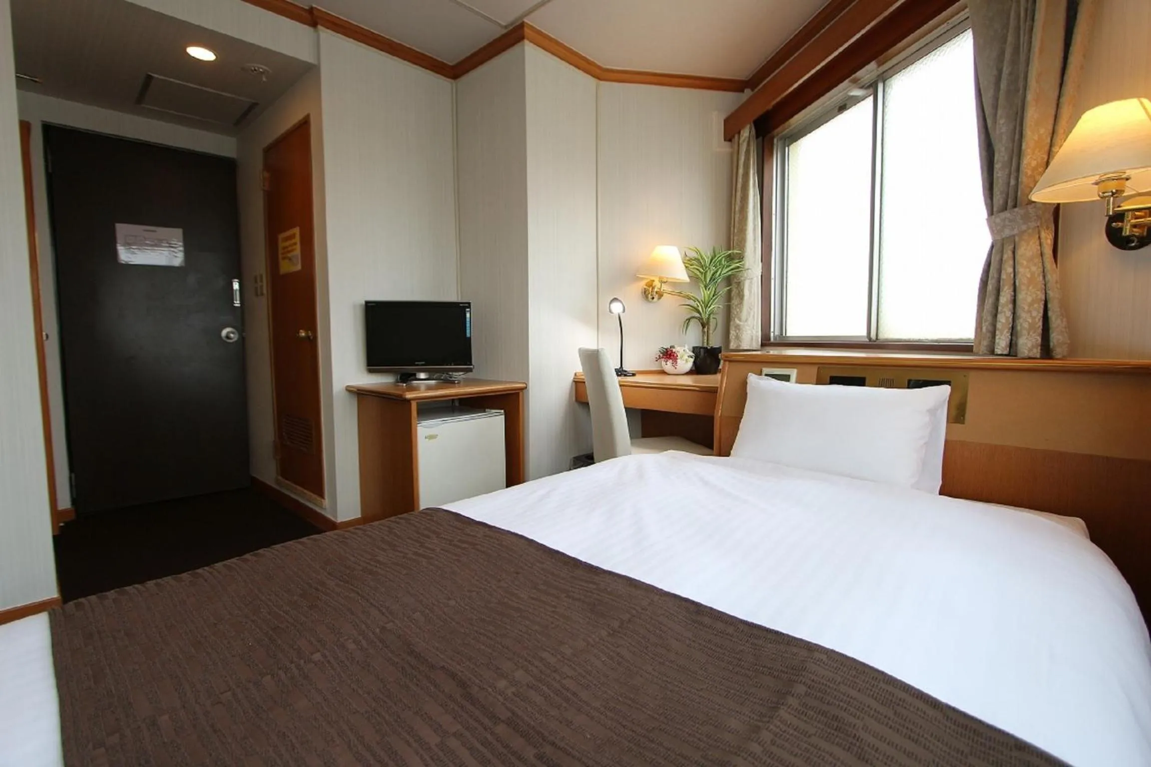 Bedroom in HOTEL LiVEMAX BUDGET Okinawa Tomariko