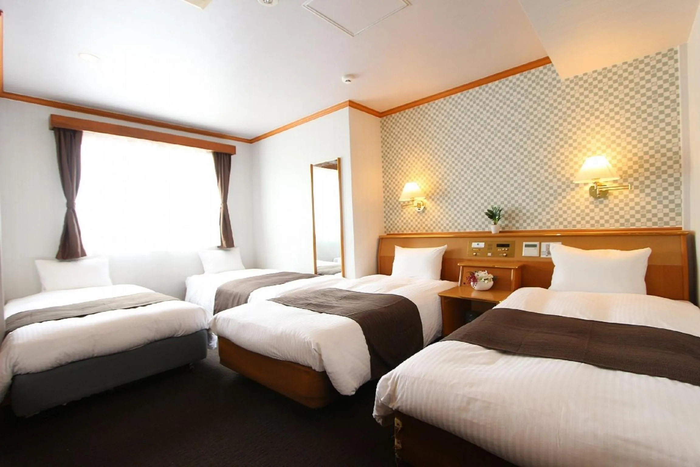 Bedroom in HOTEL LiVEMAX BUDGET Okinawa Tomariko