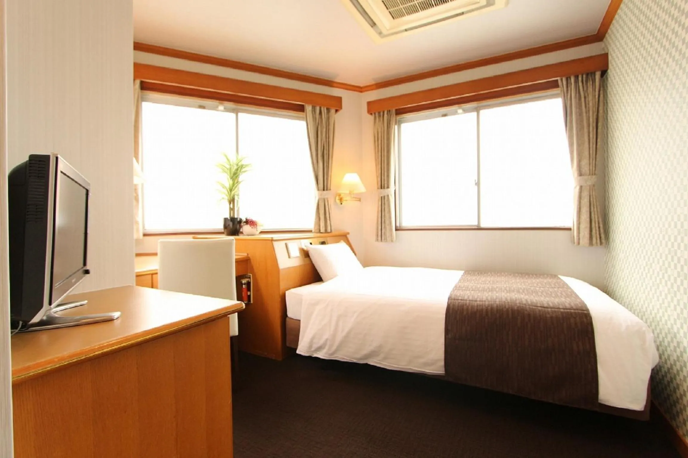 Bedroom in HOTEL LiVEMAX BUDGET Okinawa Tomariko