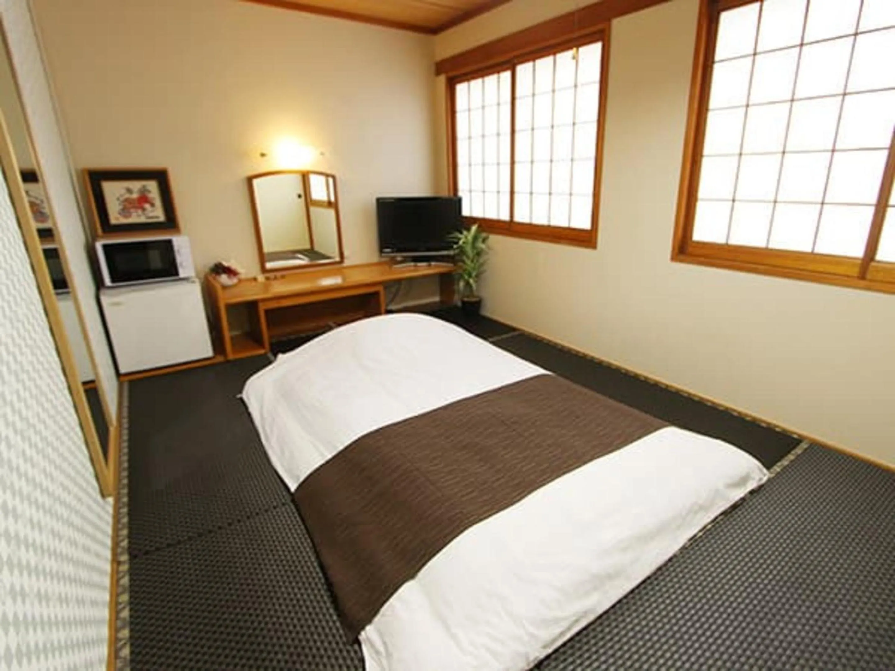 Bed in HOTEL LiVEMAX BUDGET Okinawa Tomariko