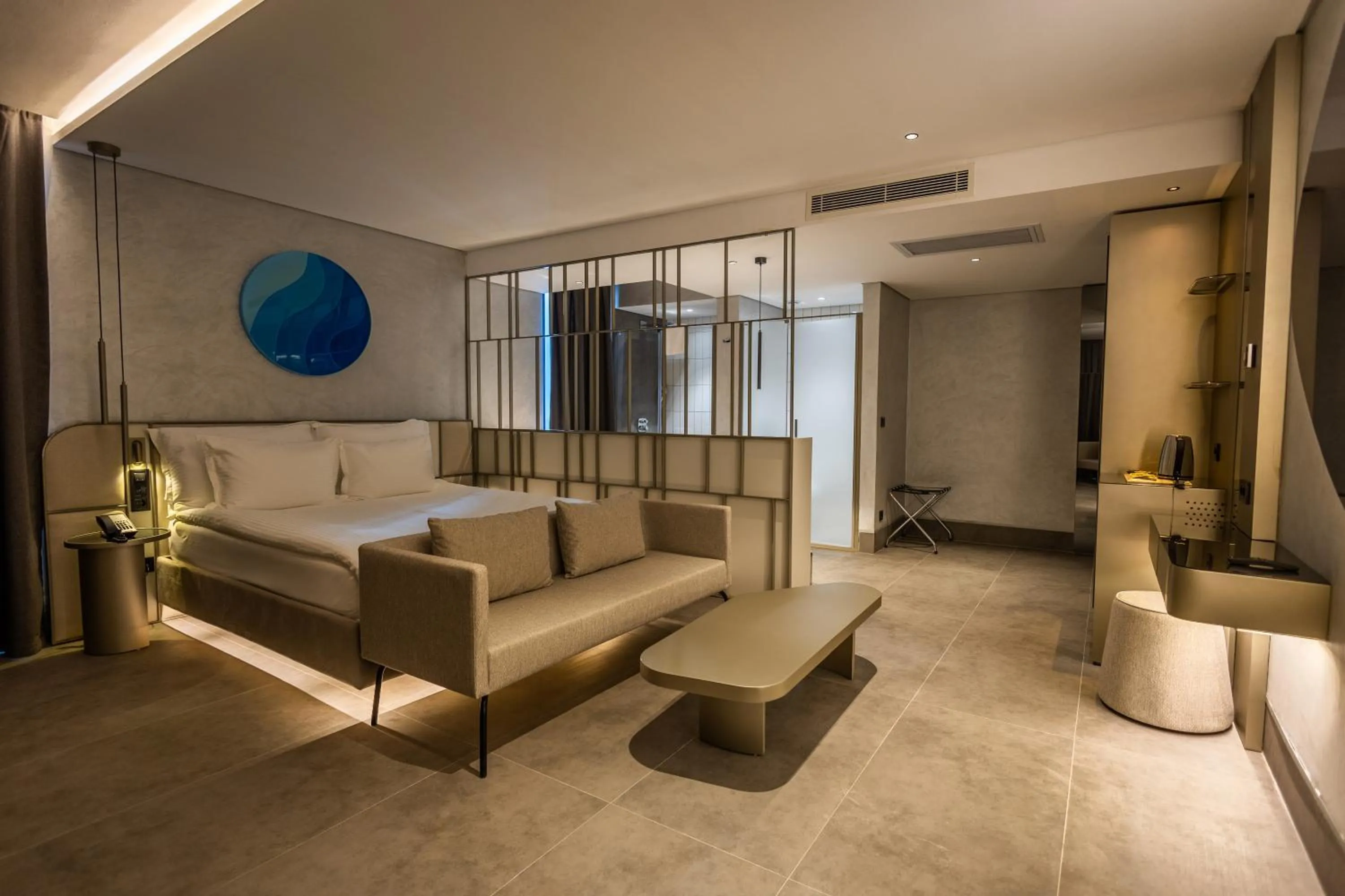 Seating area, Bed in Four Hills Hotel