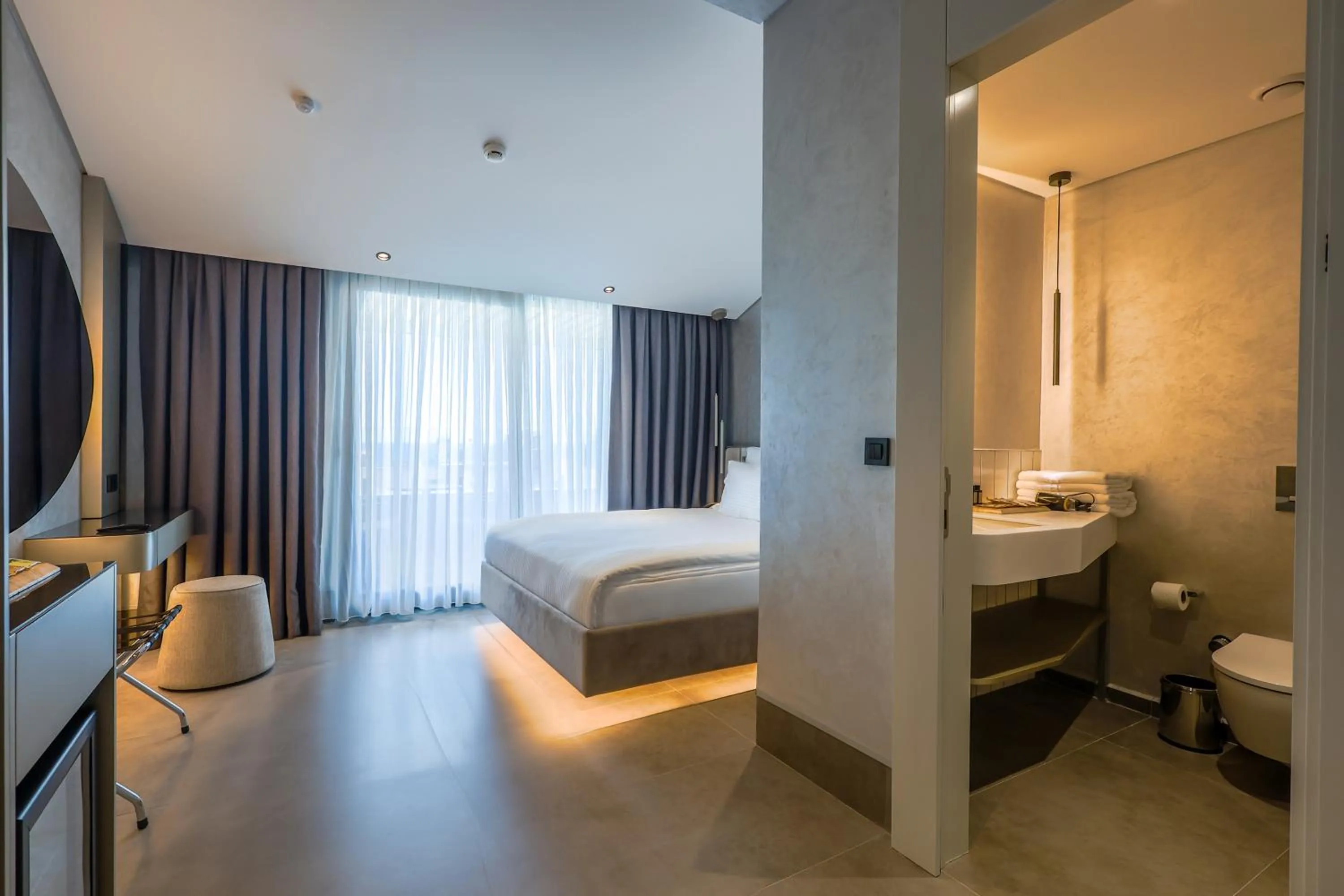 Toilet, Bed in Four Hills Hotel