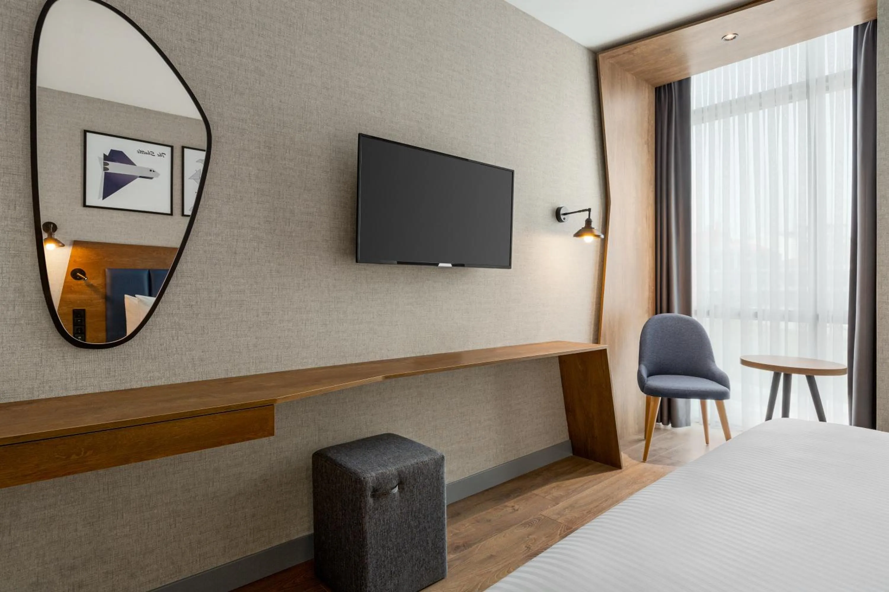 Seating area, Bed in Ramada Encore by Wyndham Istanbul Arnavutkoy