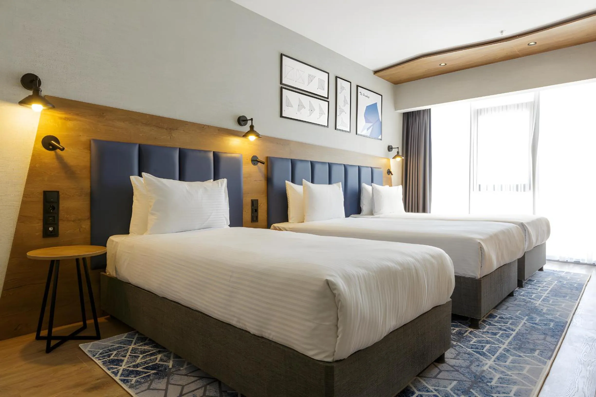 Bed in Ramada Encore by Wyndham Istanbul Arnavutkoy
