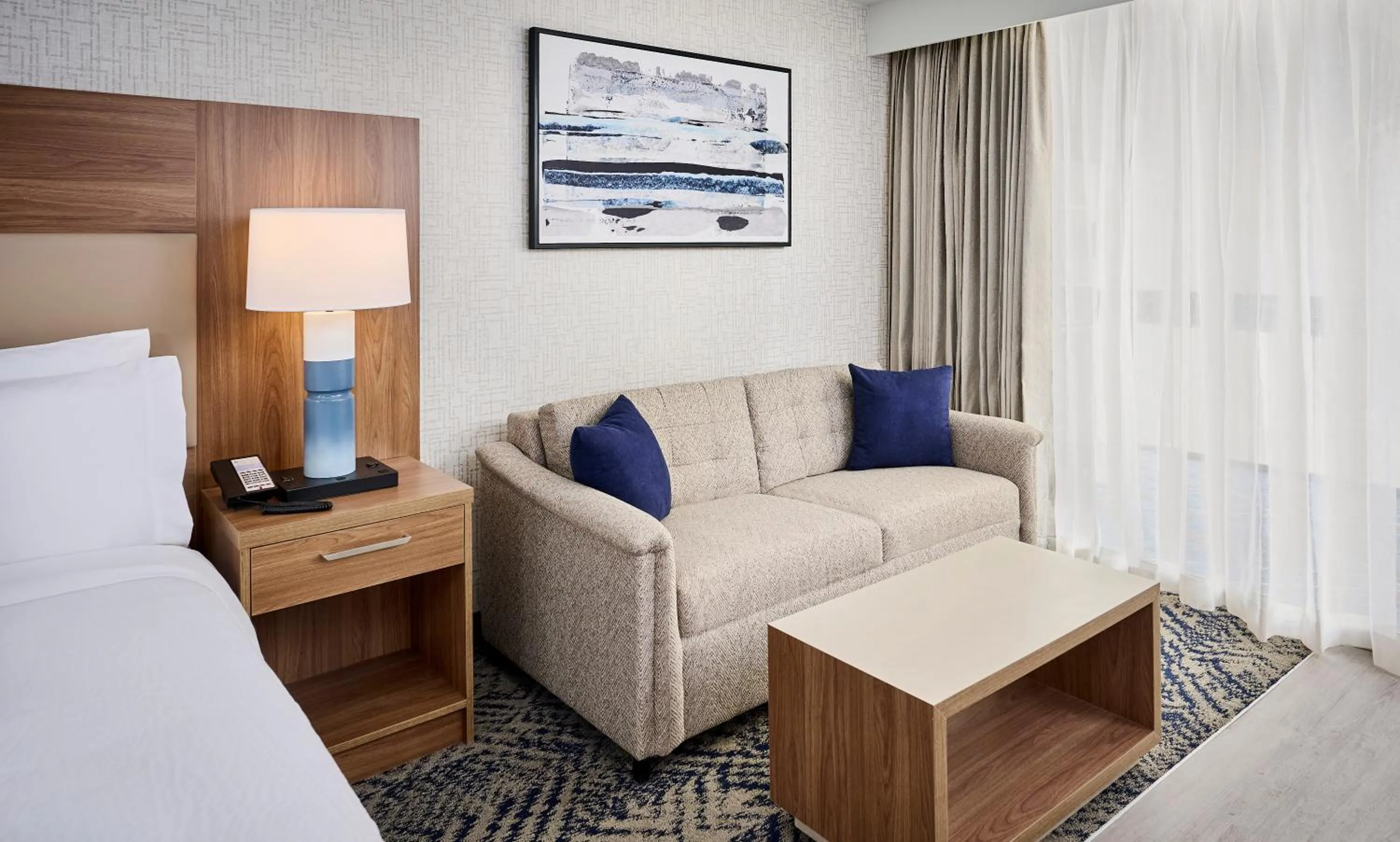 Seating area, Bed in Candlewood Suites Burlington Conference Centre by IHG