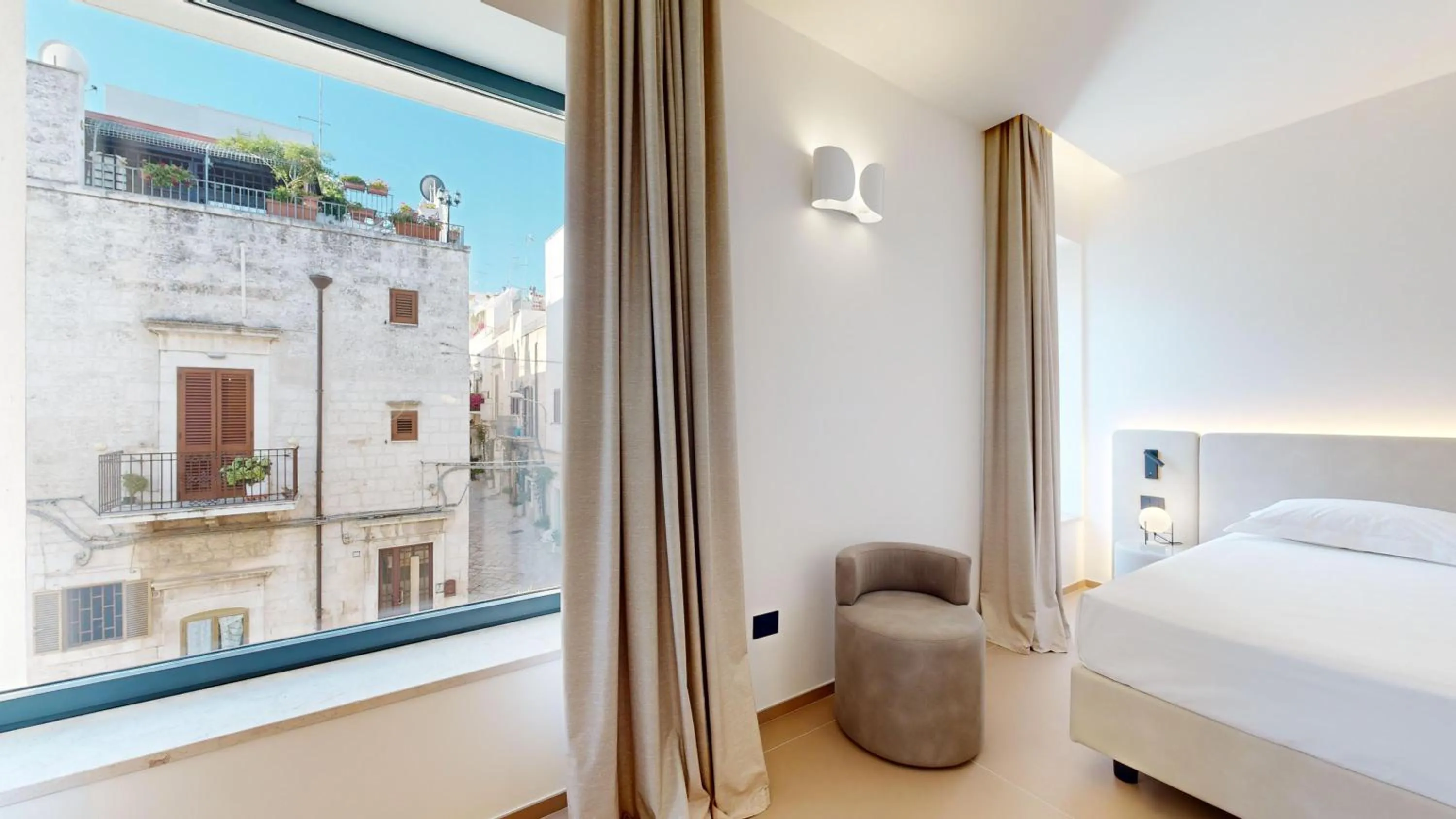 Bed in PRIMO OSTUNI HOTEL