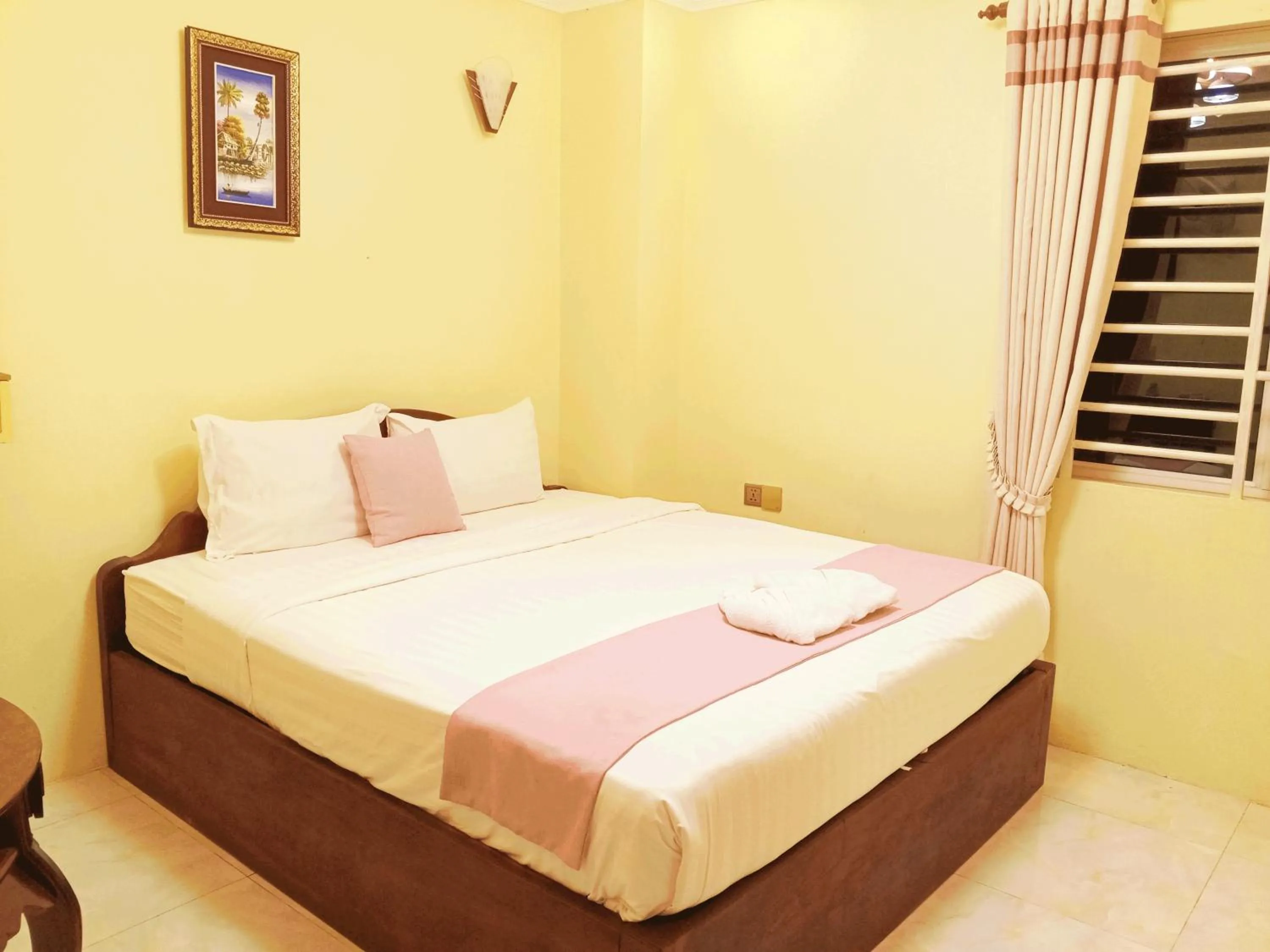 Bed in AHHA Boutique Kampot