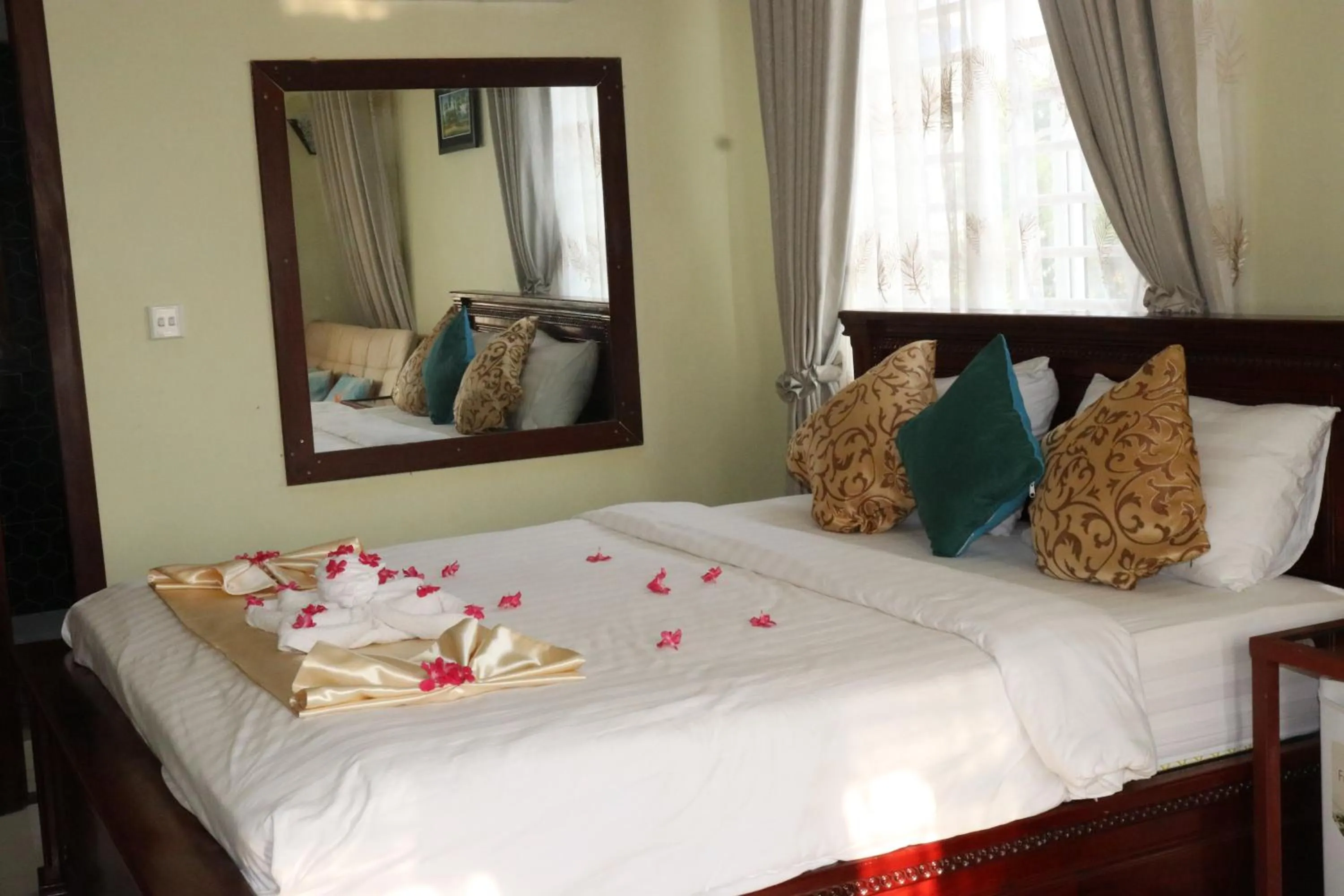 Bed in AHHA Boutique Kampot