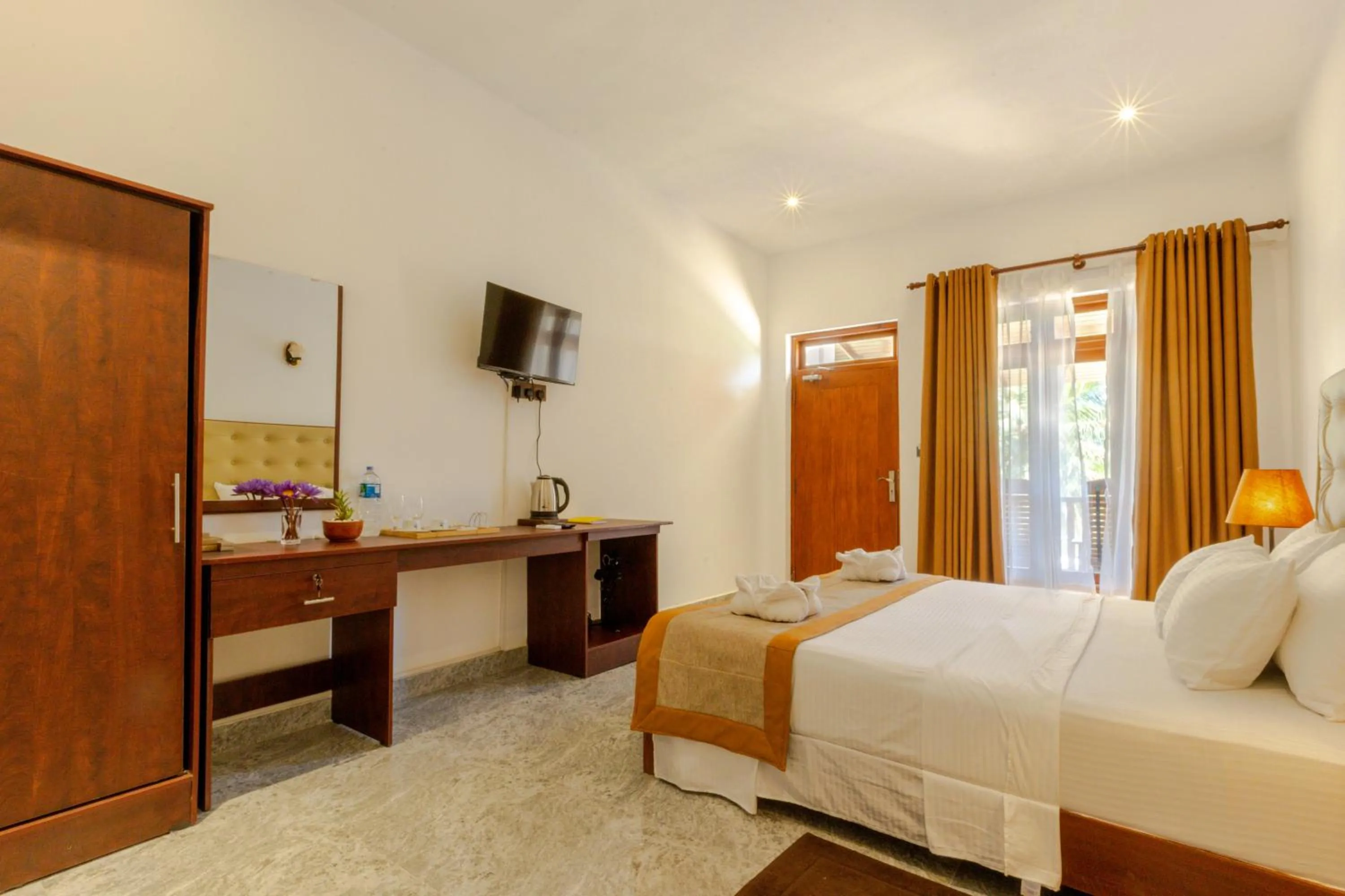 Bed in Elysia Sigiriya Hotel