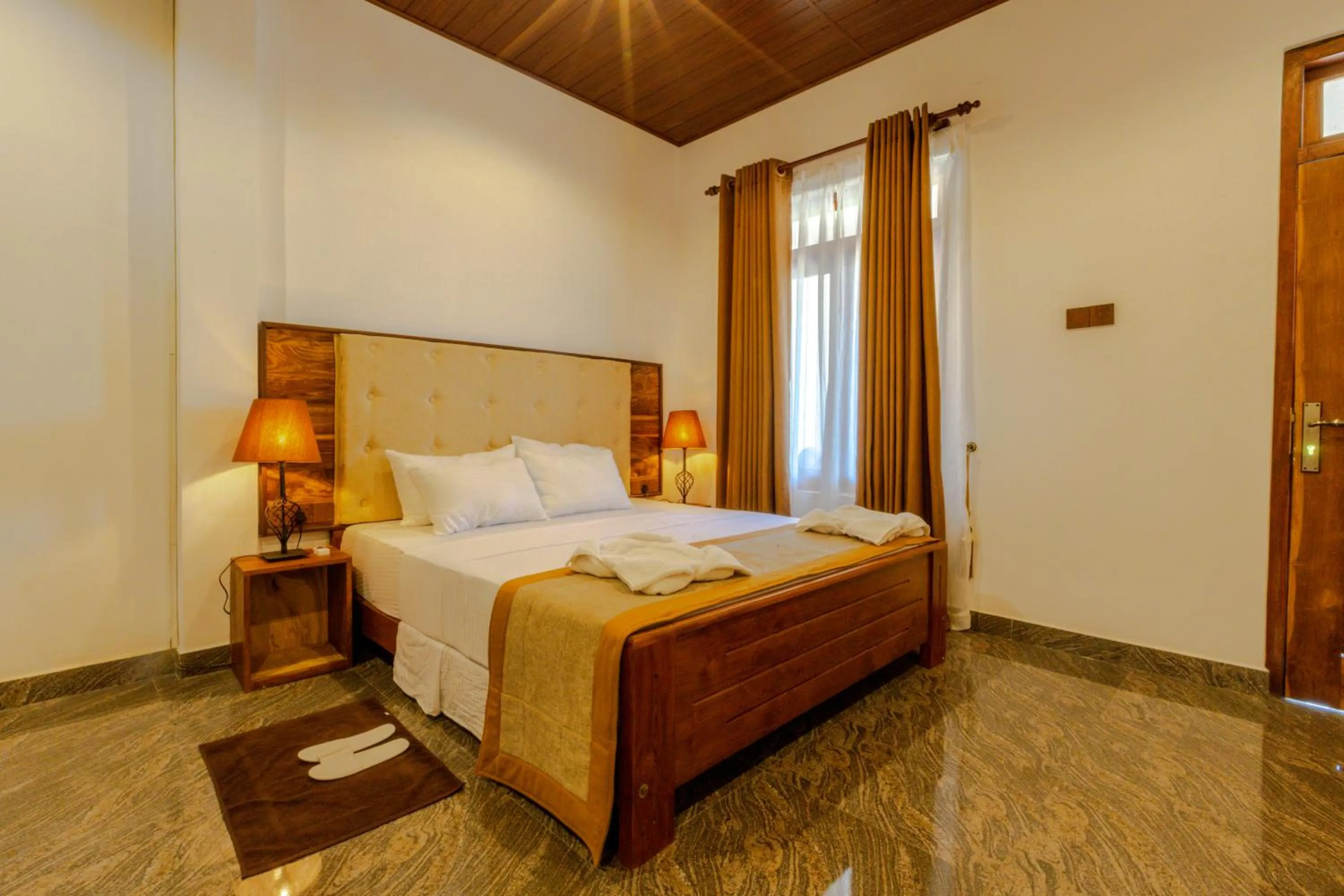 Bed in Elysia Sigiriya Hotel