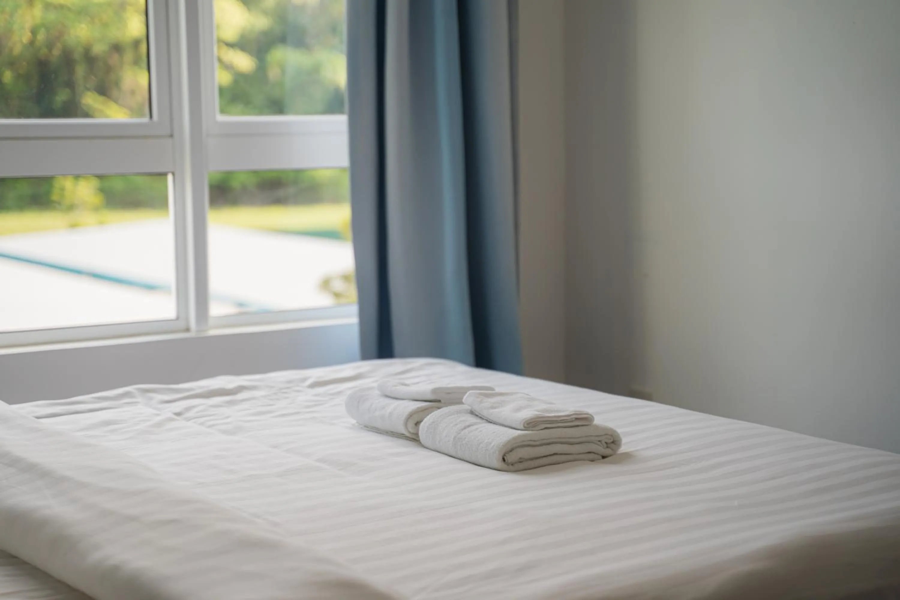 towels, Bed in Trival Broadway Hut Homestay Sri Indah, Sandakan