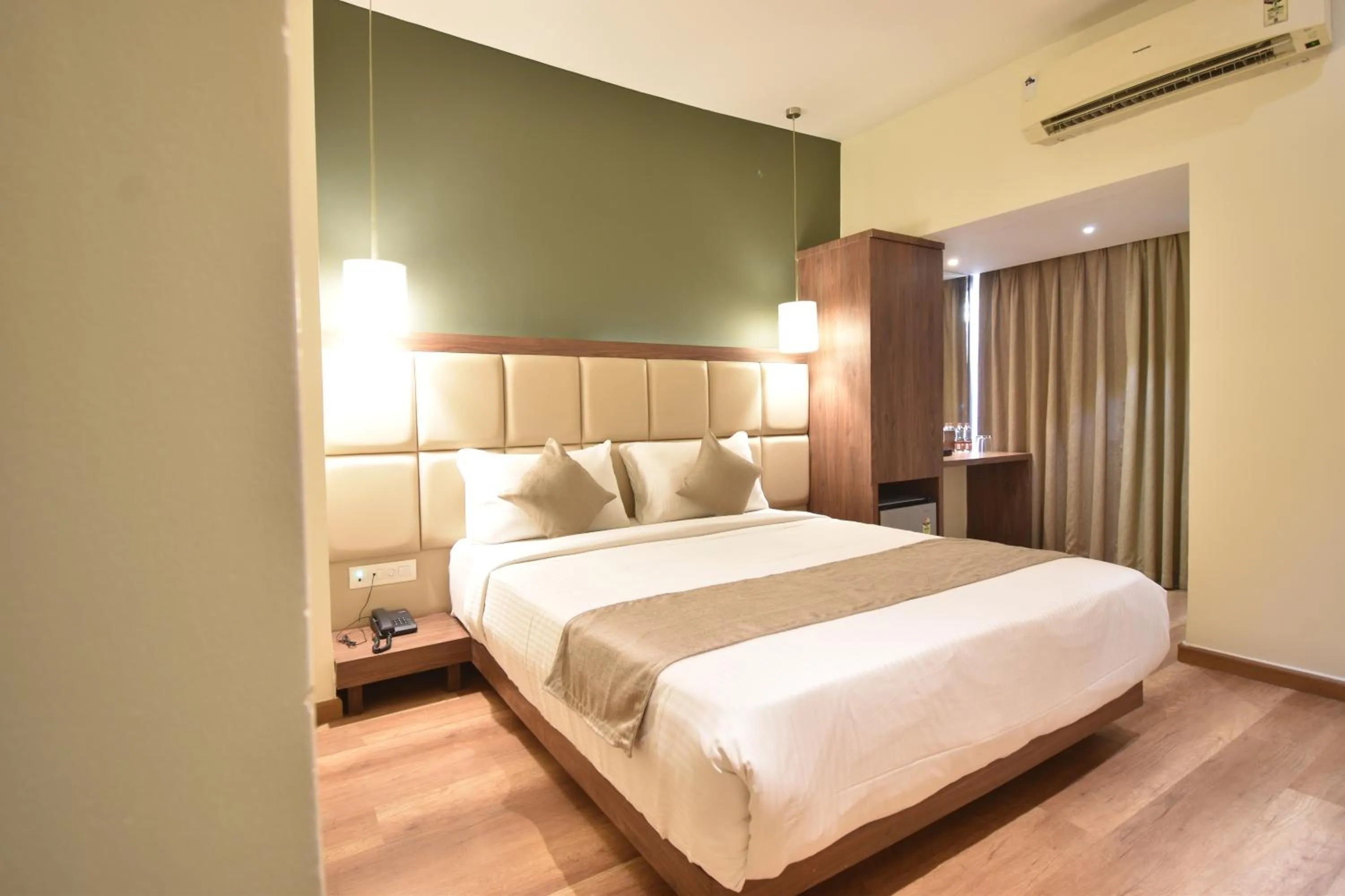 Bed in The Aarya A Smart Business Hotel