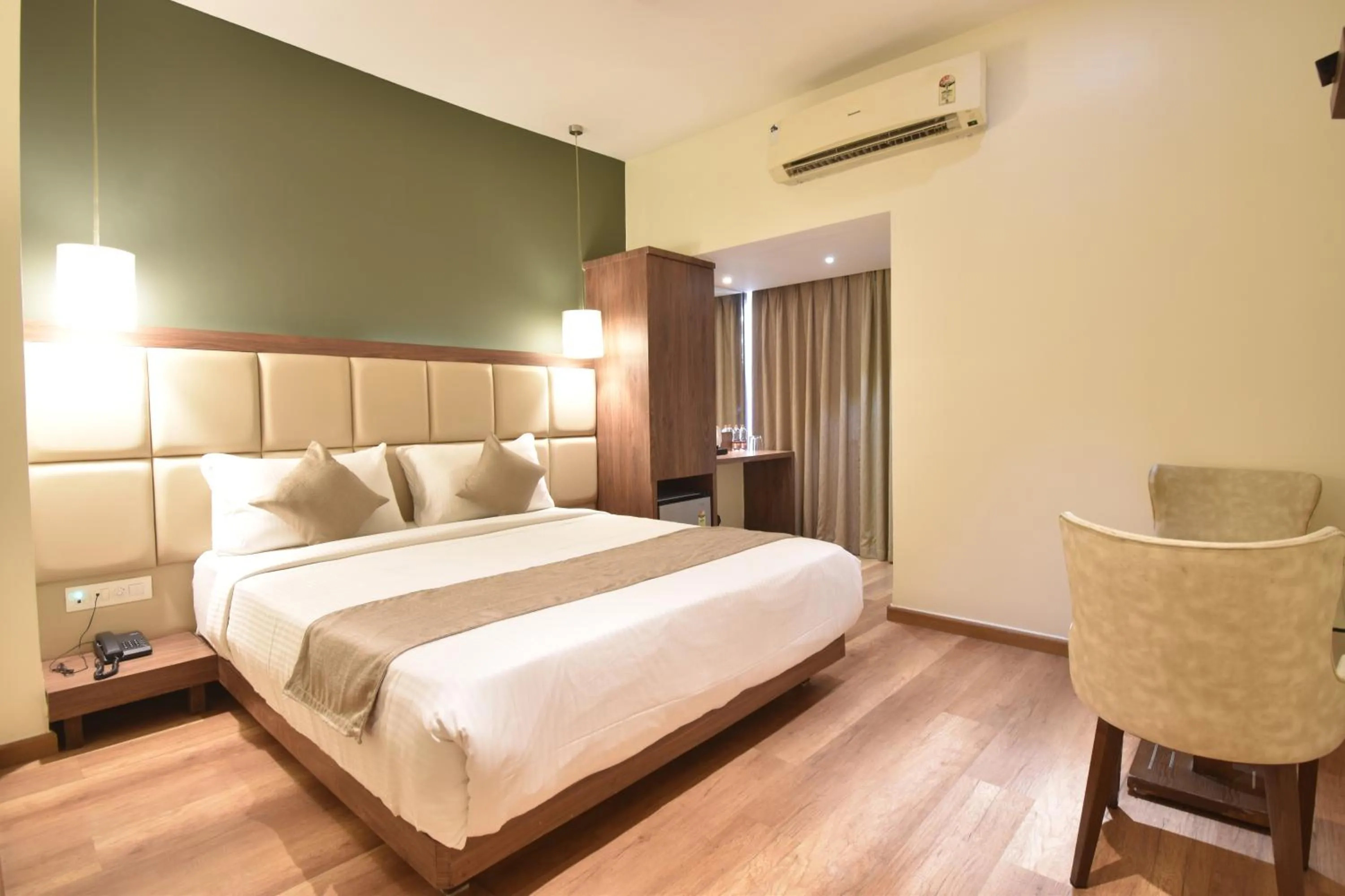 air conditioner, Bed in The Aarya A Smart Business Hotel