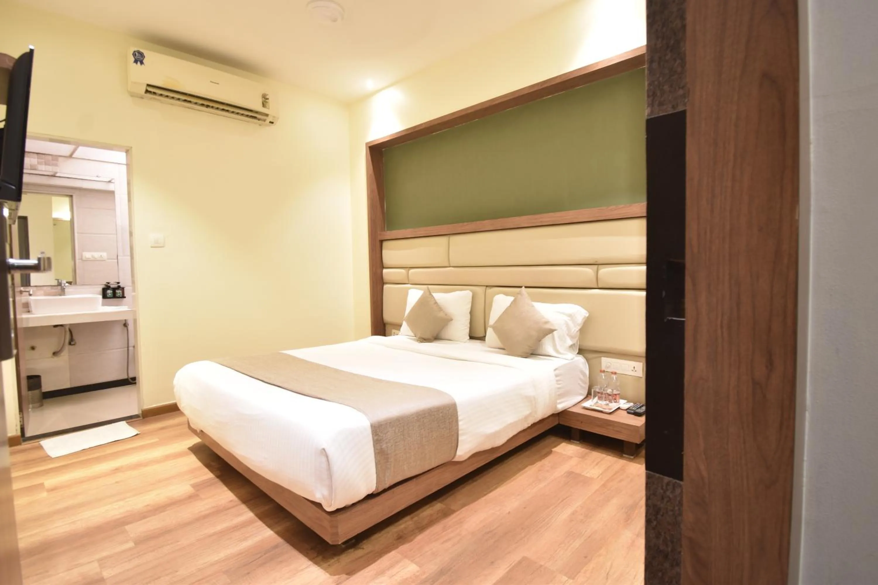 Photo of the whole room, Bed in The Aarya A Smart Business Hotel