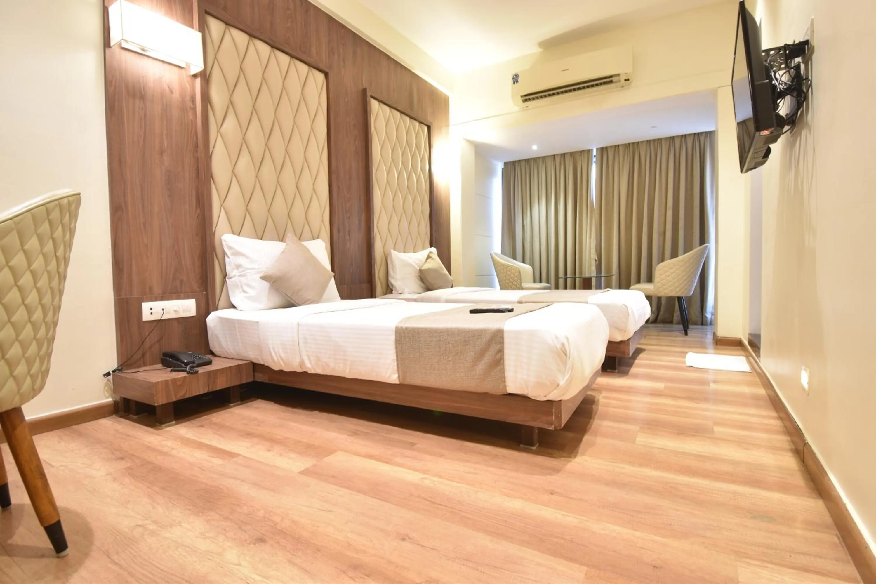 towels, Bed in The Aarya A Smart Business Hotel