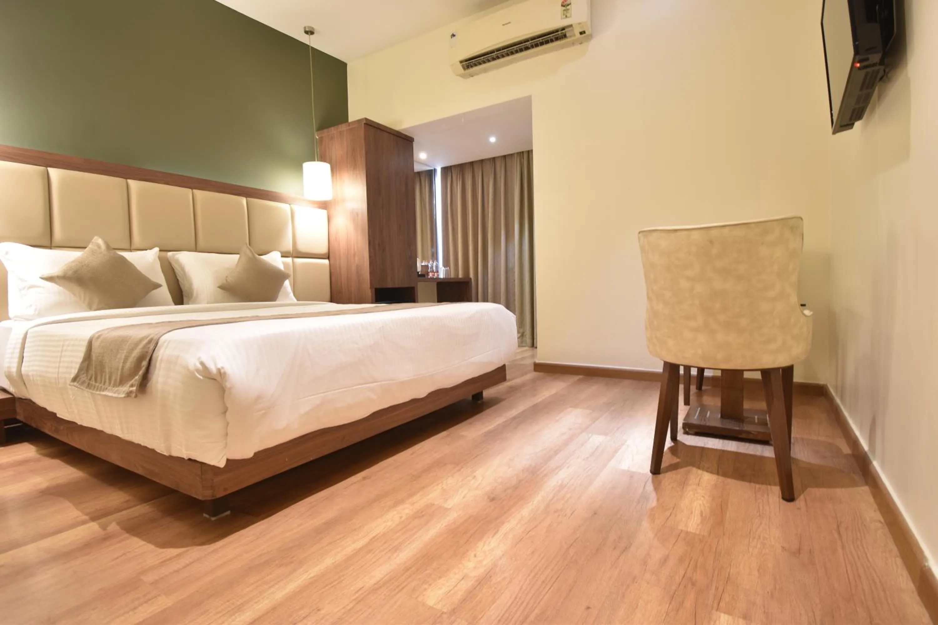 air conditioner, Bed in The Aarya A Smart Business Hotel