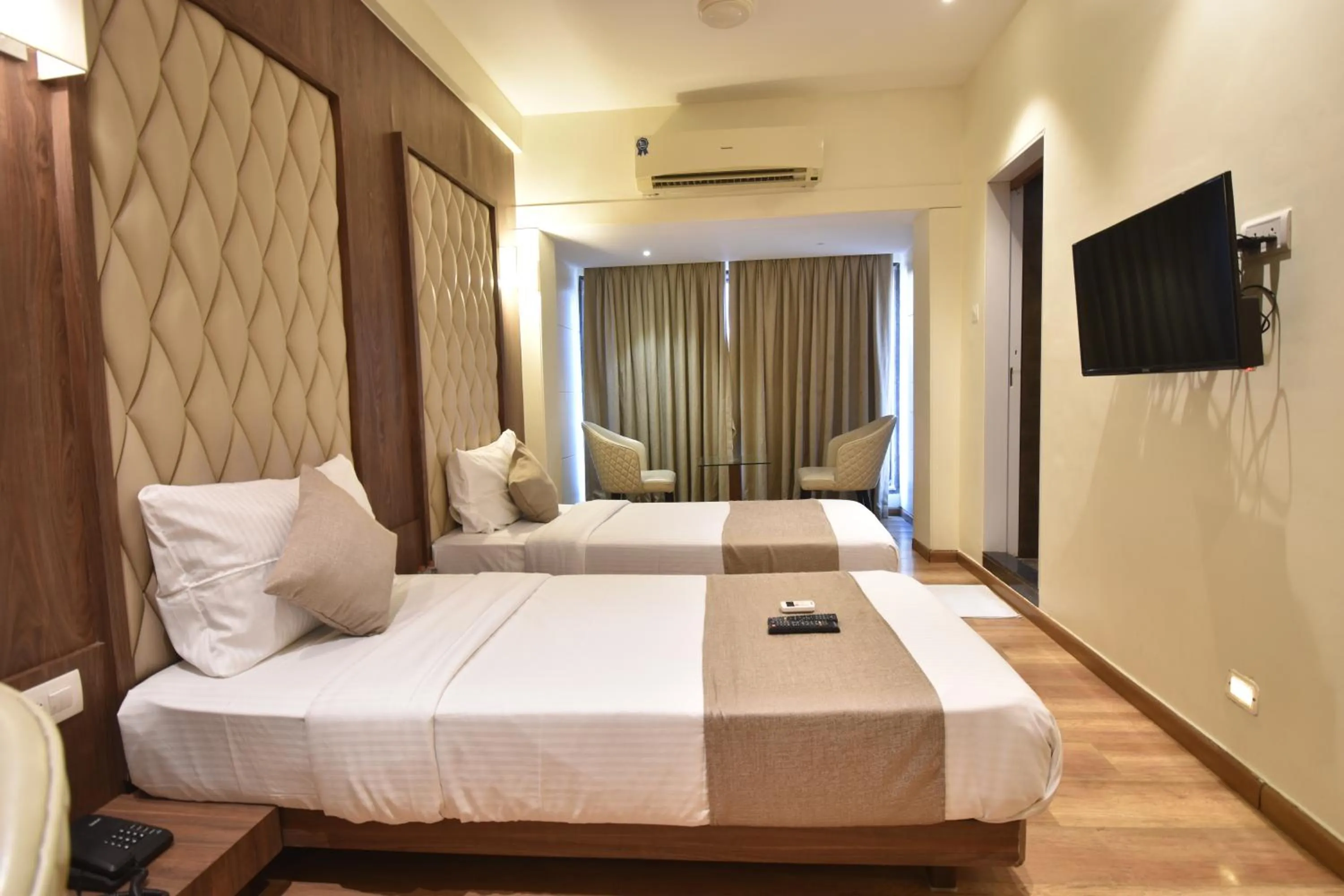 TV and multimedia, Bed in The Aarya A Smart Business Hotel