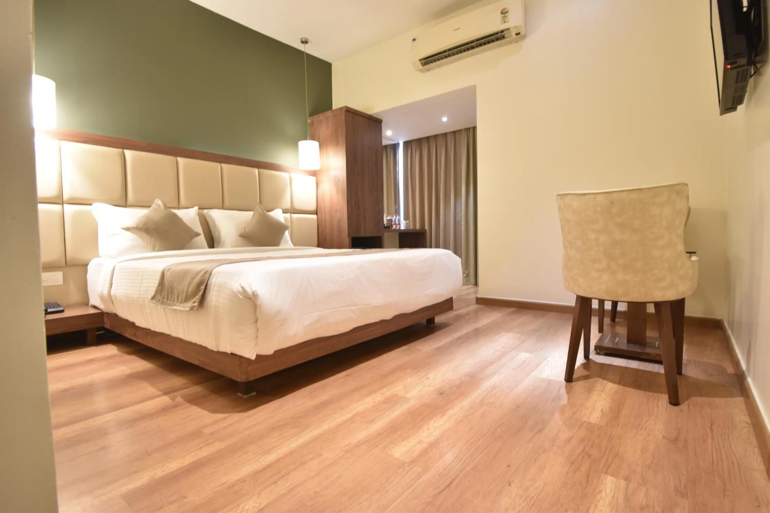 Bed in The Aarya A Smart Business Hotel