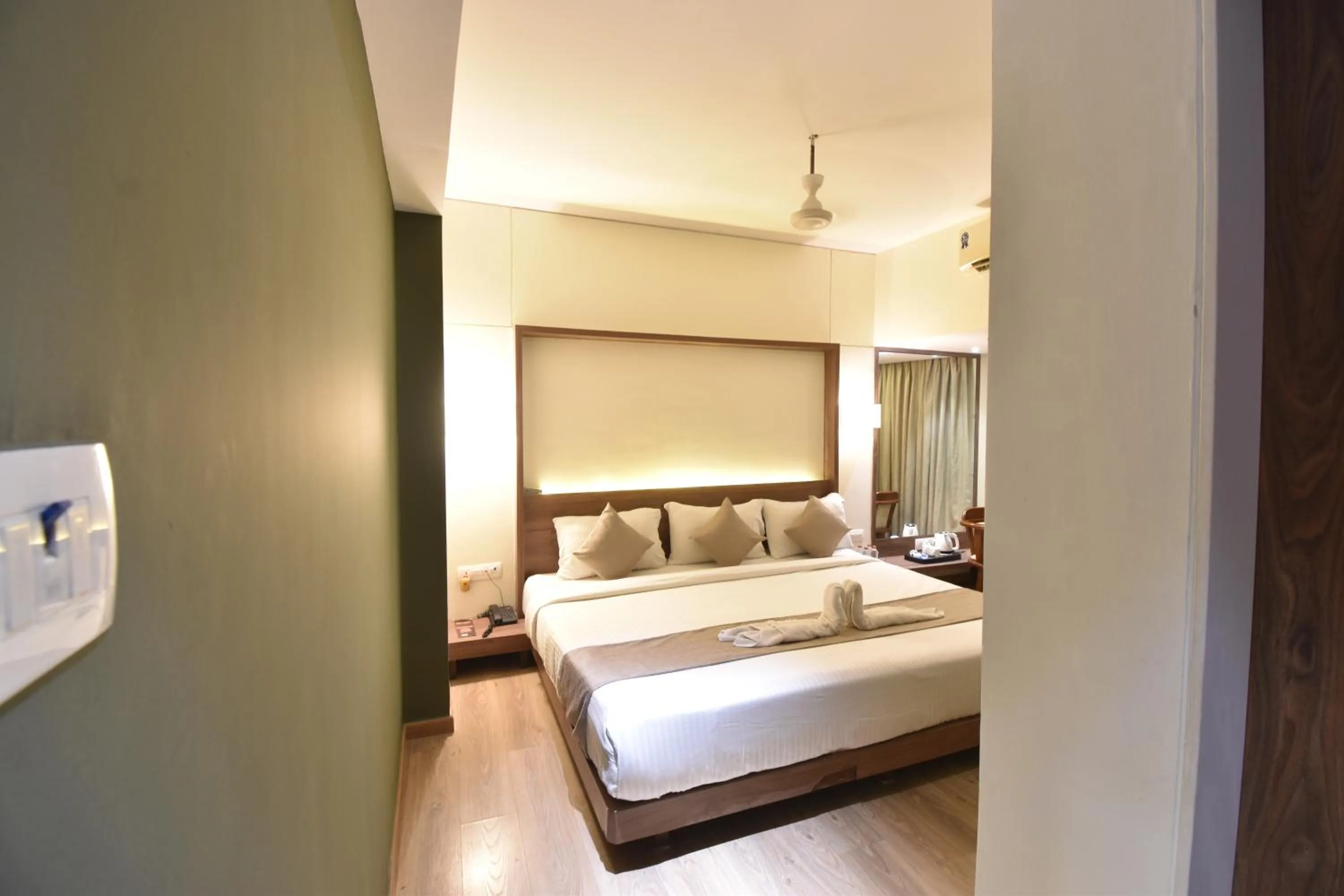 Bed in The Aarya A Smart Business Hotel