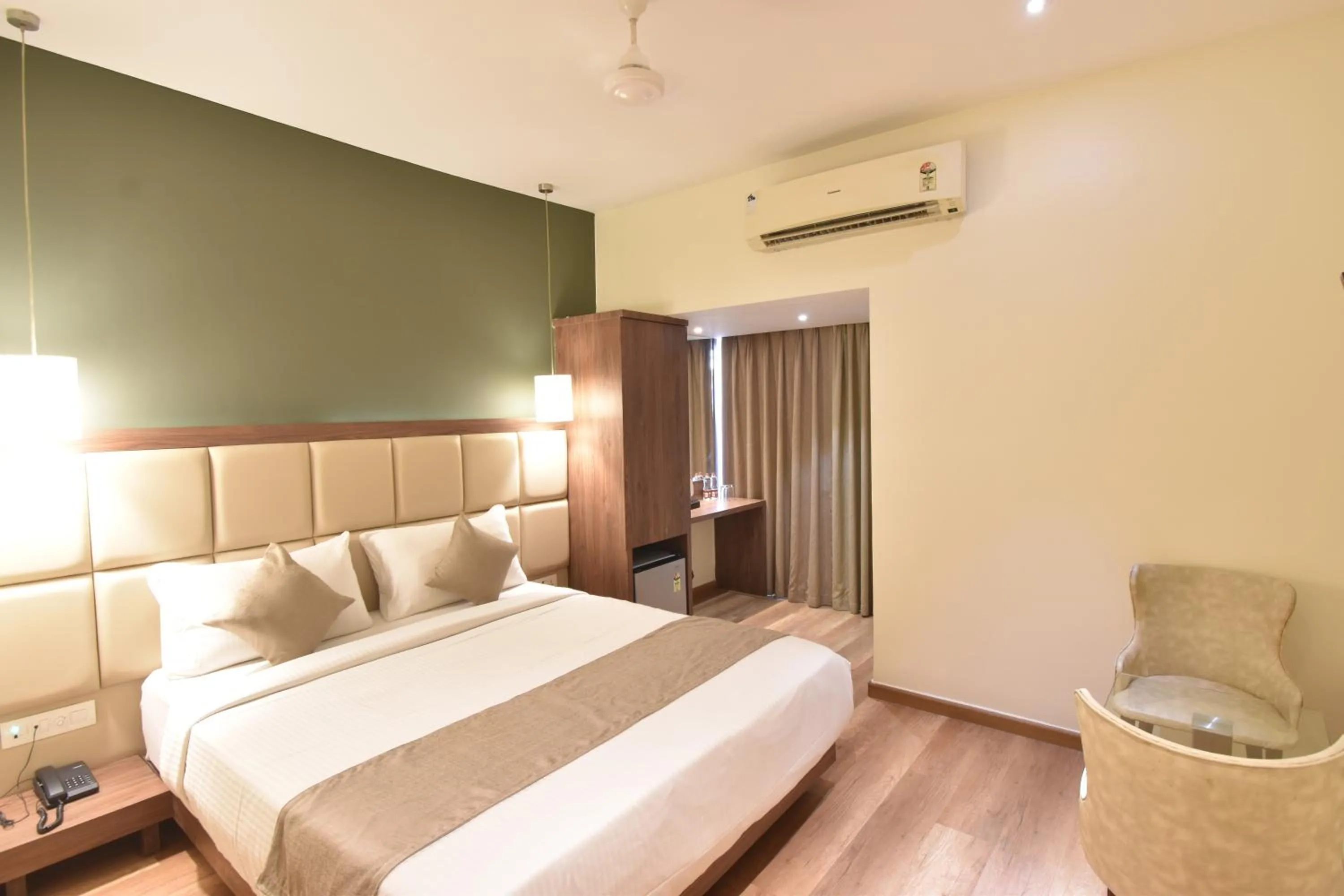 air conditioner, Bed in The Aarya A Smart Business Hotel