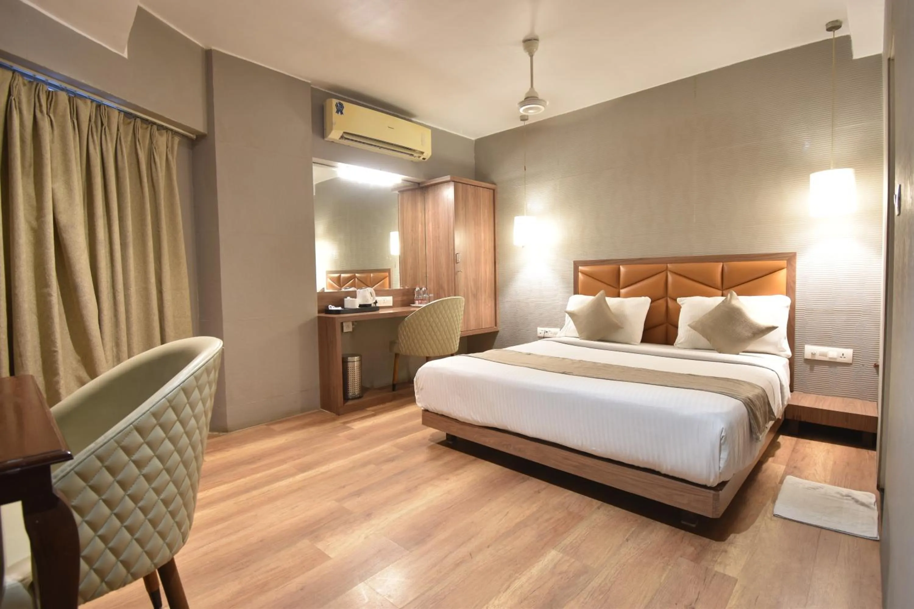 Living room, Bed in The Aarya A Smart Business Hotel