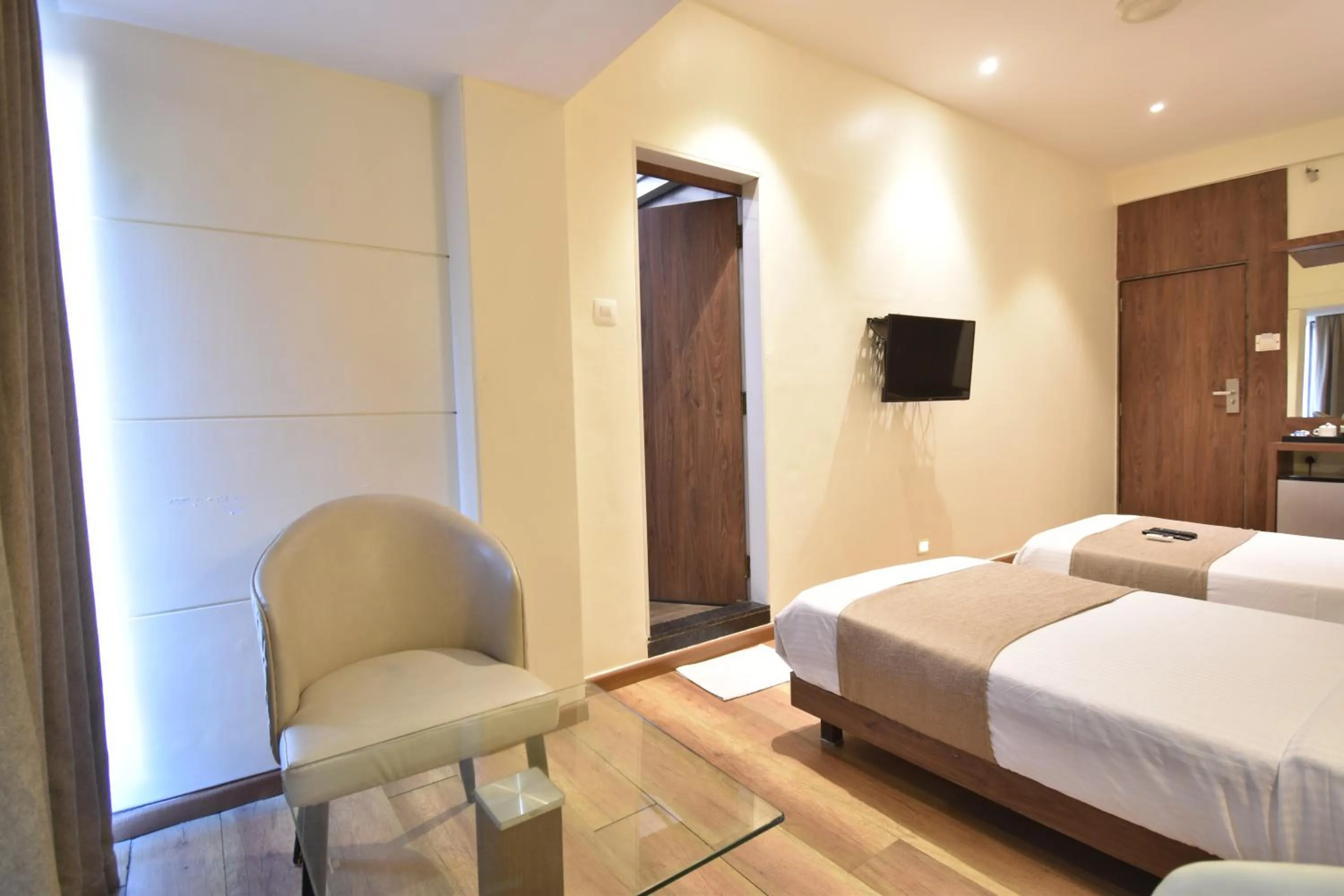 TV and multimedia, Bed in The Aarya A Smart Business Hotel