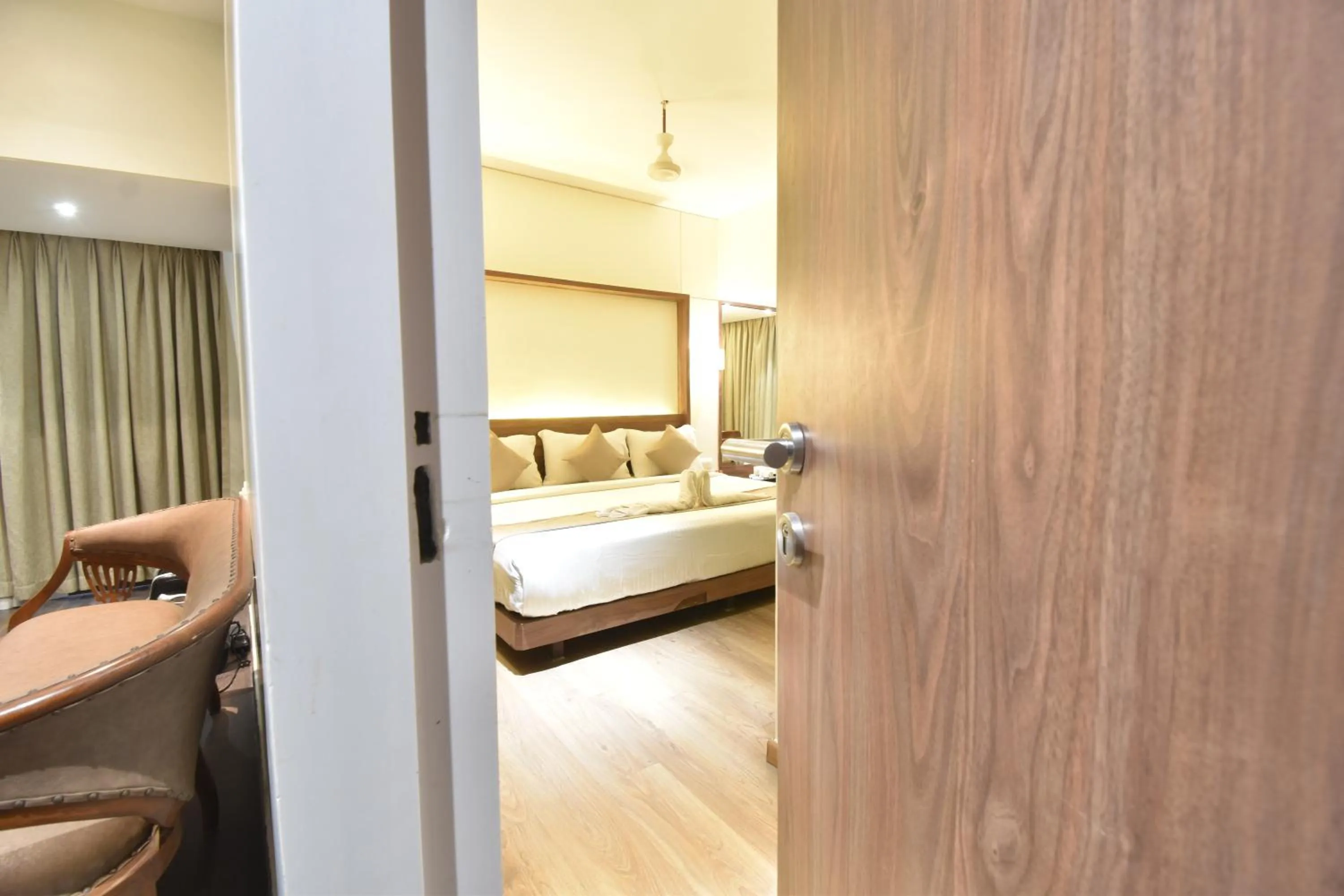 Bed in The Aarya A Smart Business Hotel