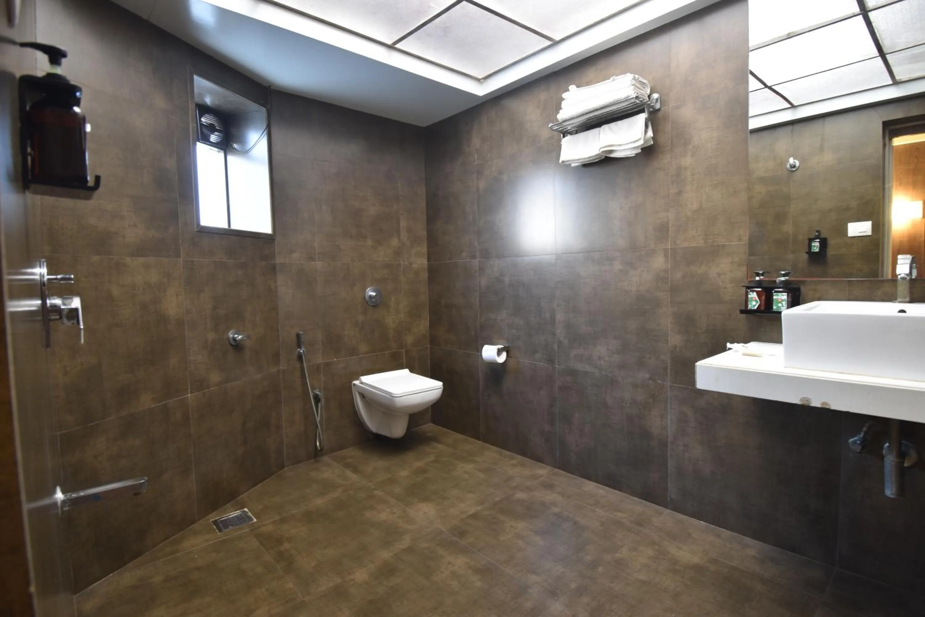Bathroom in The Aarya A Smart Business Hotel