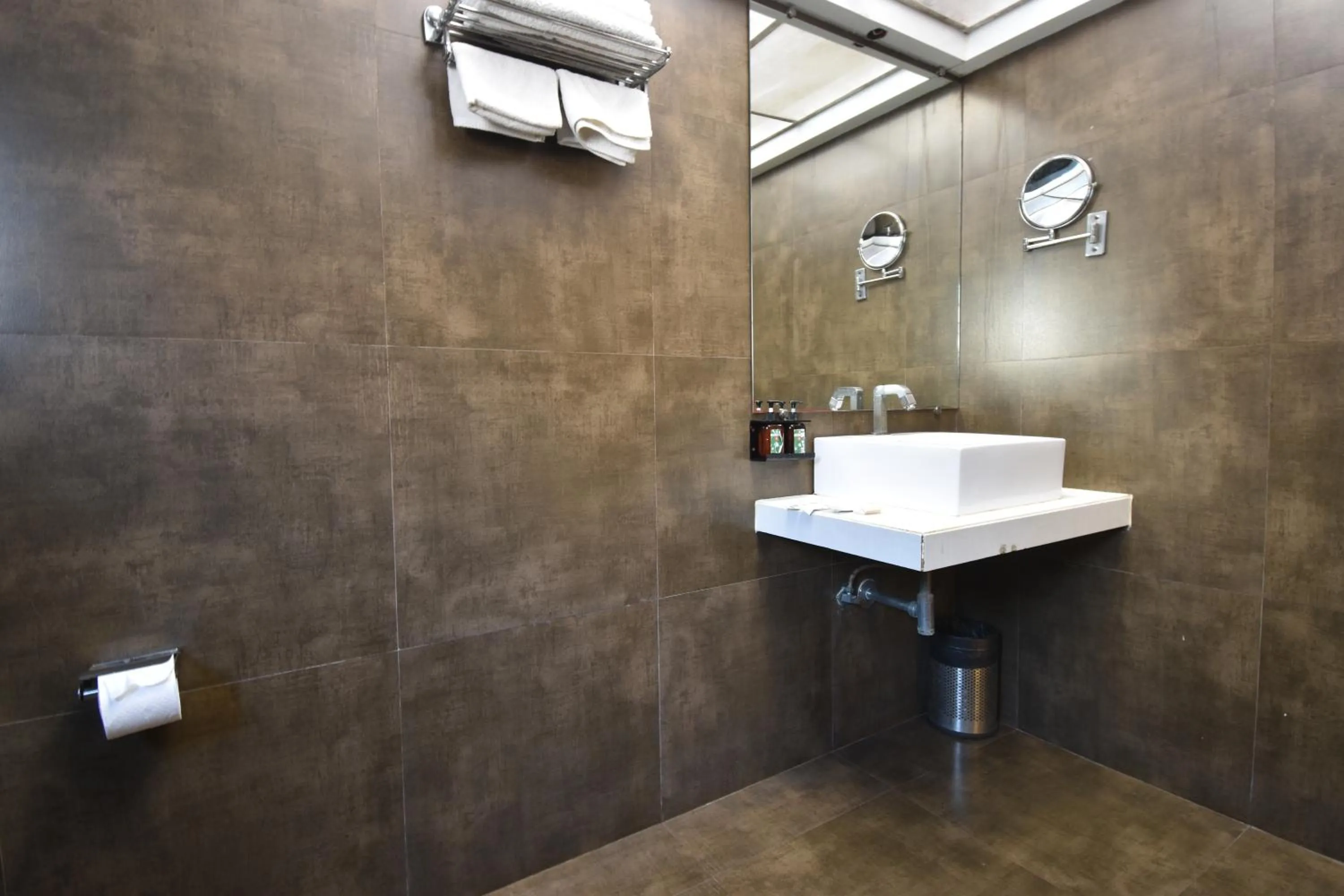 Bathroom in The Aarya A Smart Business Hotel