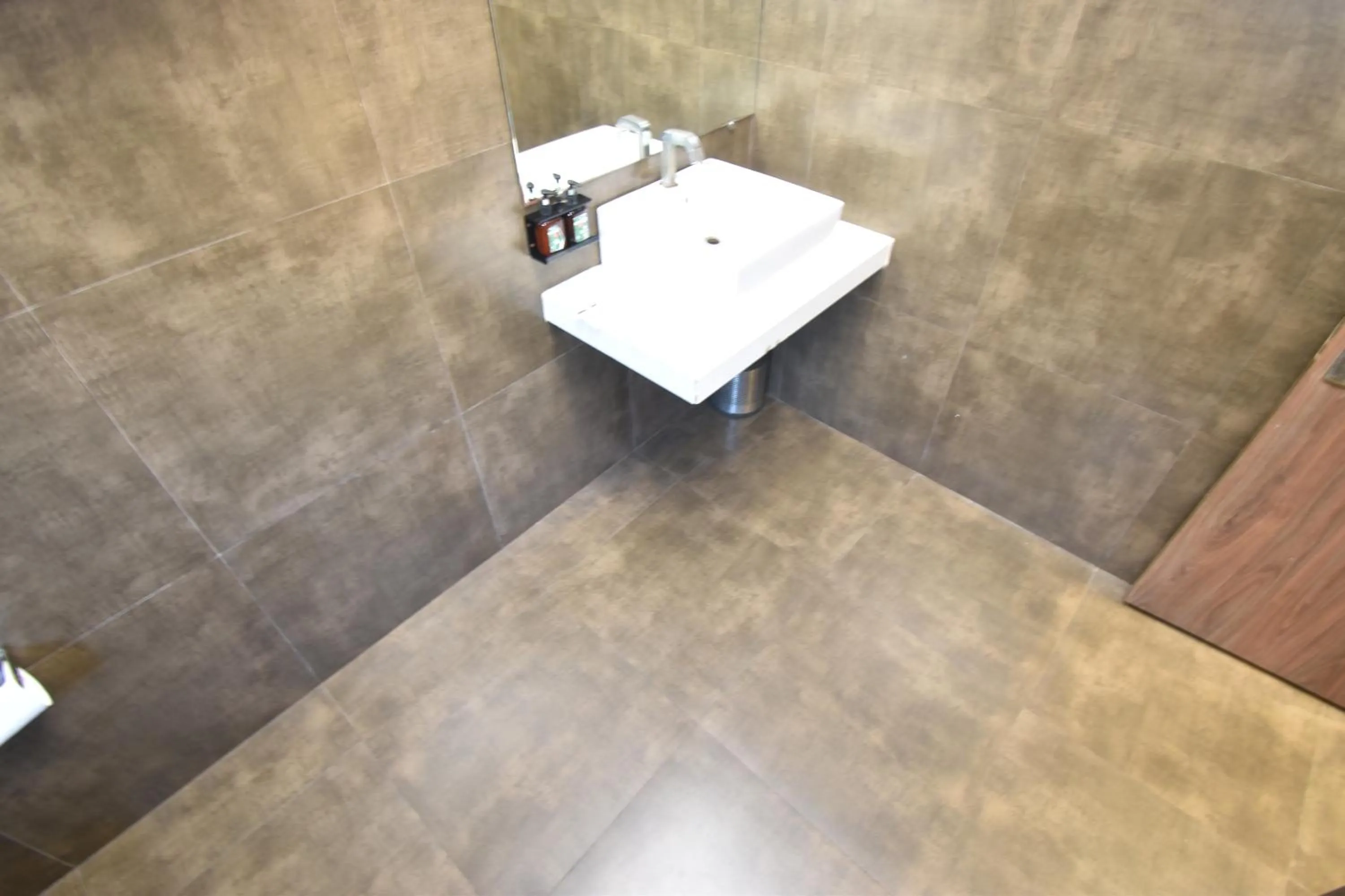 Bathroom in The Aarya A Smart Business Hotel