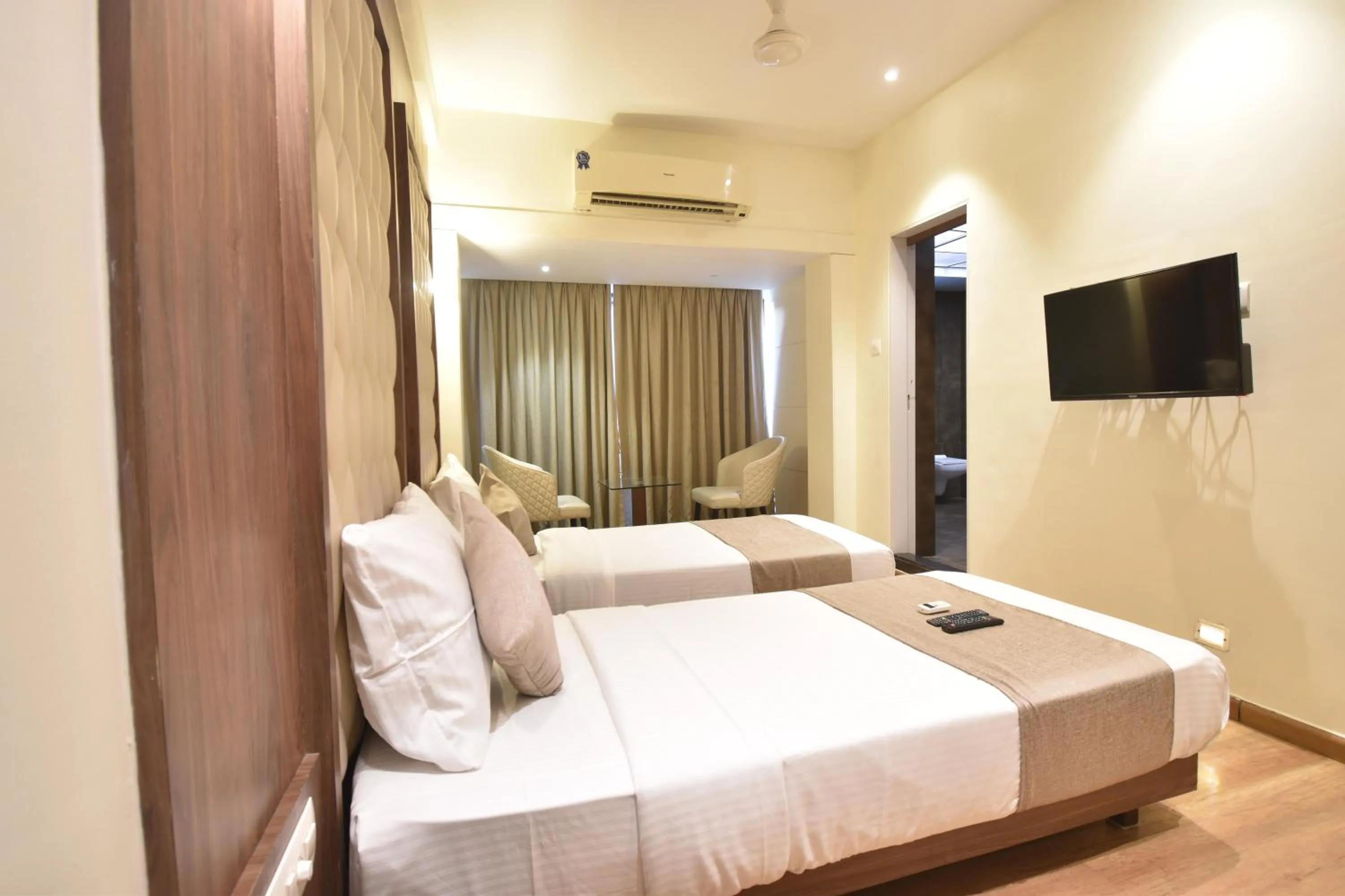 Bed in The Aarya A Smart Business Hotel